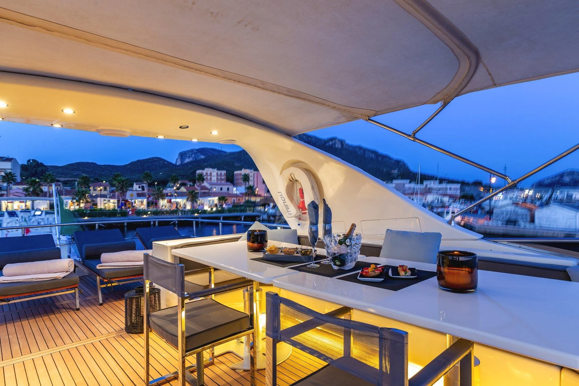 a room with a view of a city and a large body of water aboard MINOU Yacht for Sale