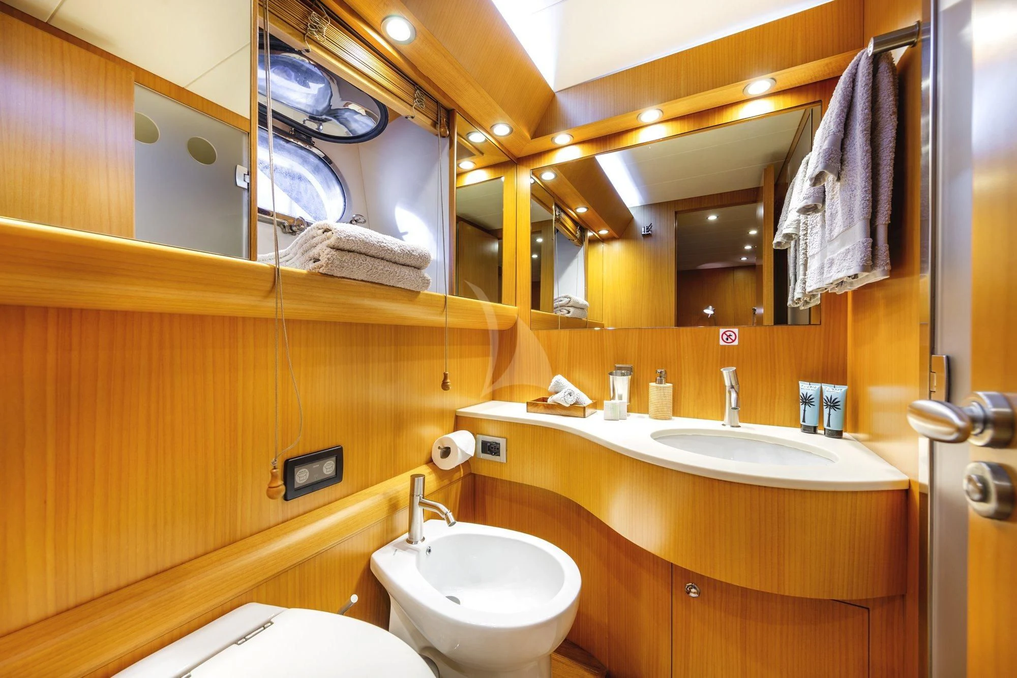 a bathroom with a sink and a mirror aboard MINOU Yacht for Sale