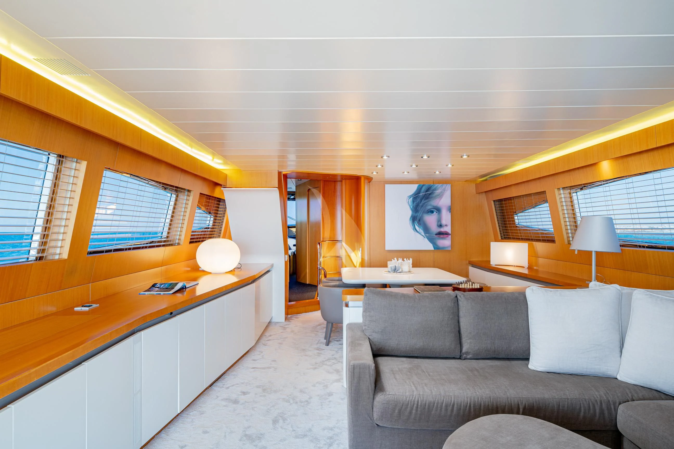 a living room with a couch and a desk aboard MINOU Yacht for Sale