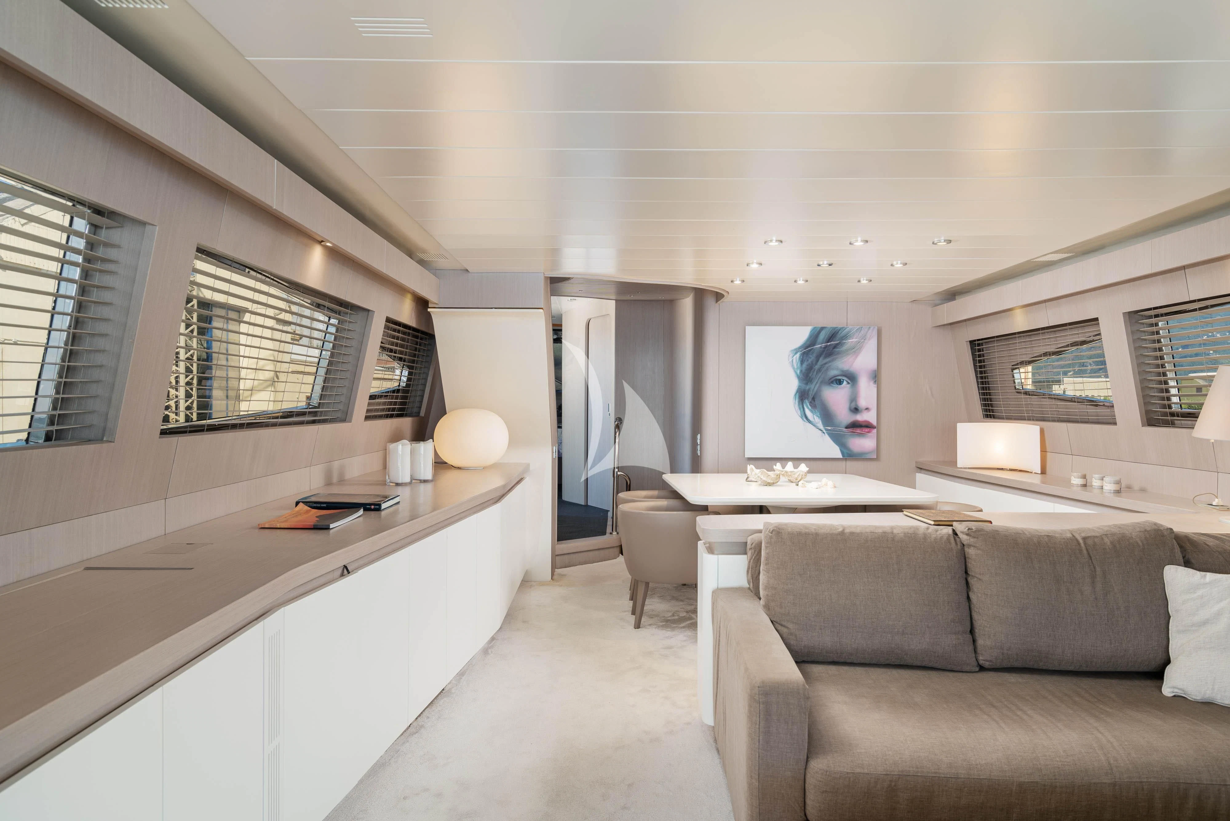 a living room with a couch and a table aboard MINOU Yacht for Sale