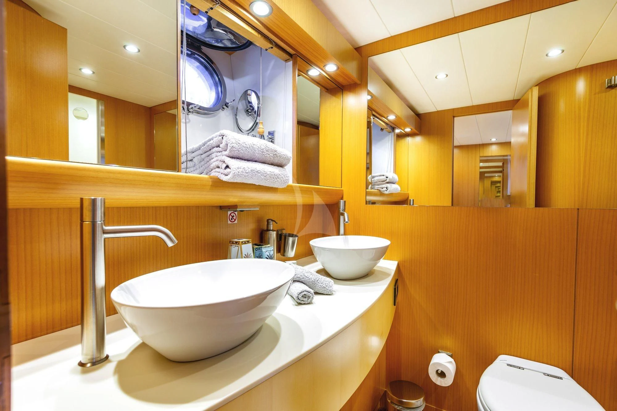 a bathroom with a sink and a mirror aboard MINOU Yacht for Sale