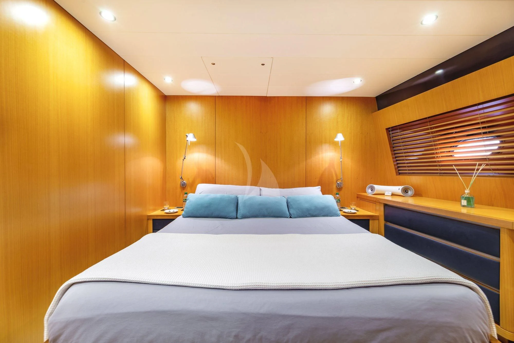 a bed with a white sheet aboard MINOU Yacht for Sale