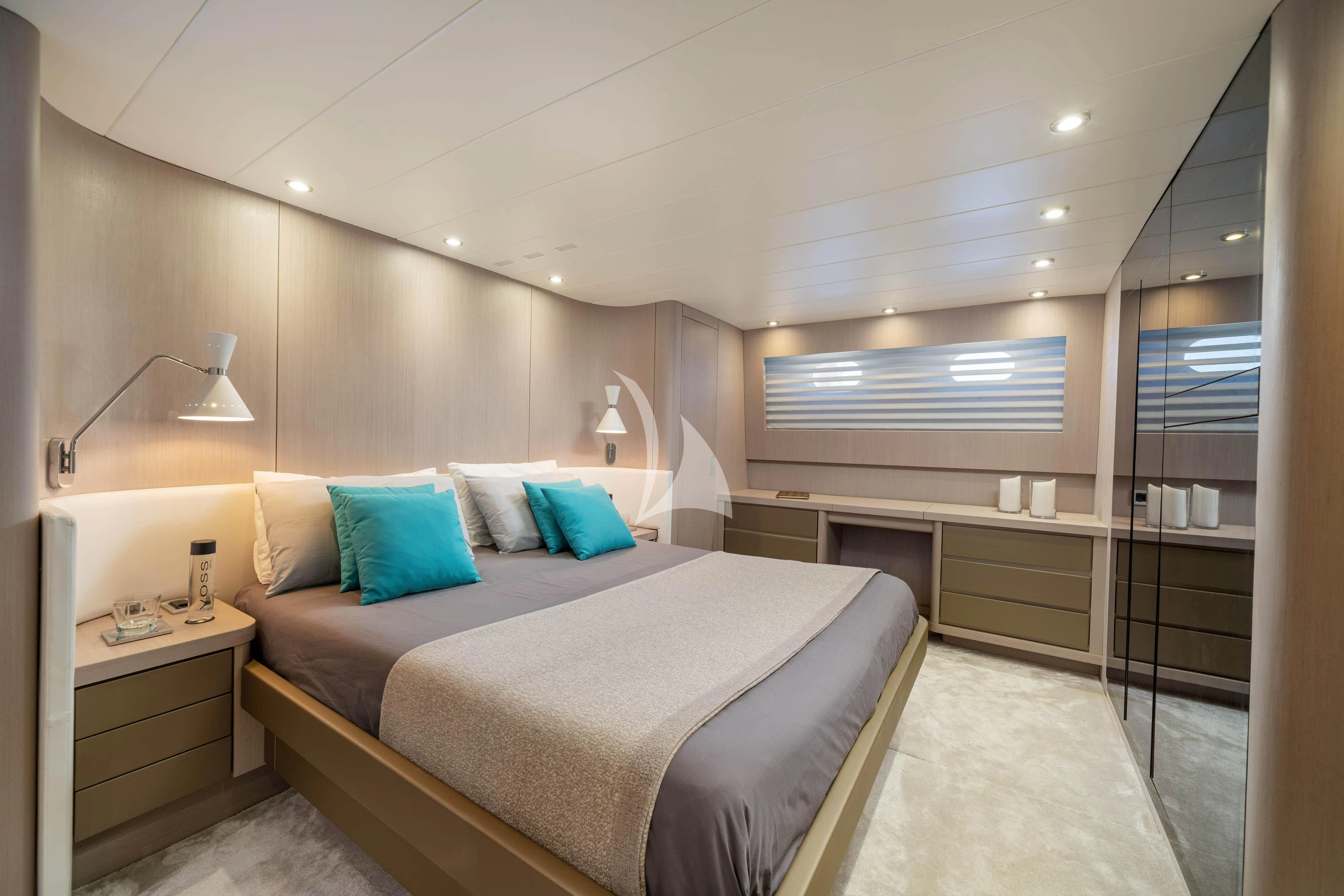 a large bedroom with a bed aboard MINOU Yacht for Sale