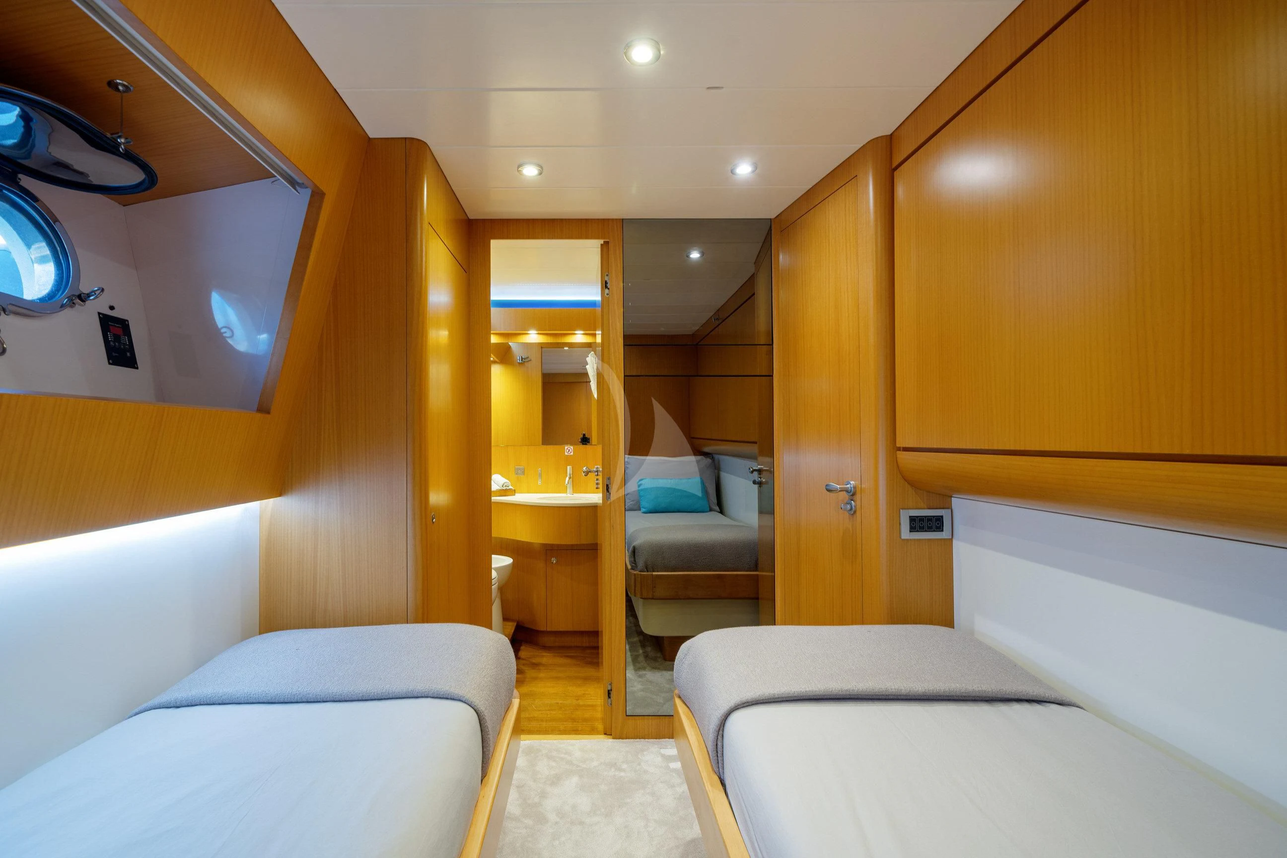 a room with a bed and a chair aboard MINOU Yacht for Sale