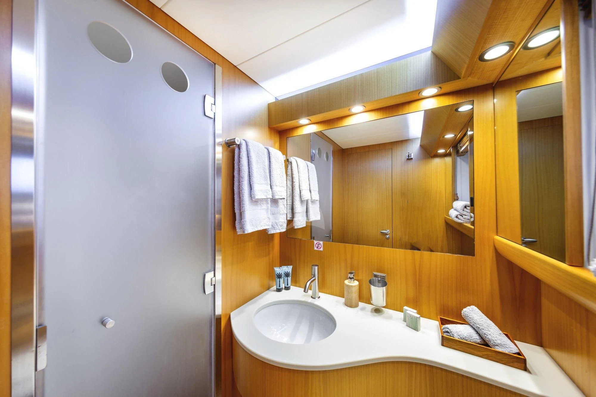 a bathroom with a sink and mirror aboard MINOU Yacht for Sale