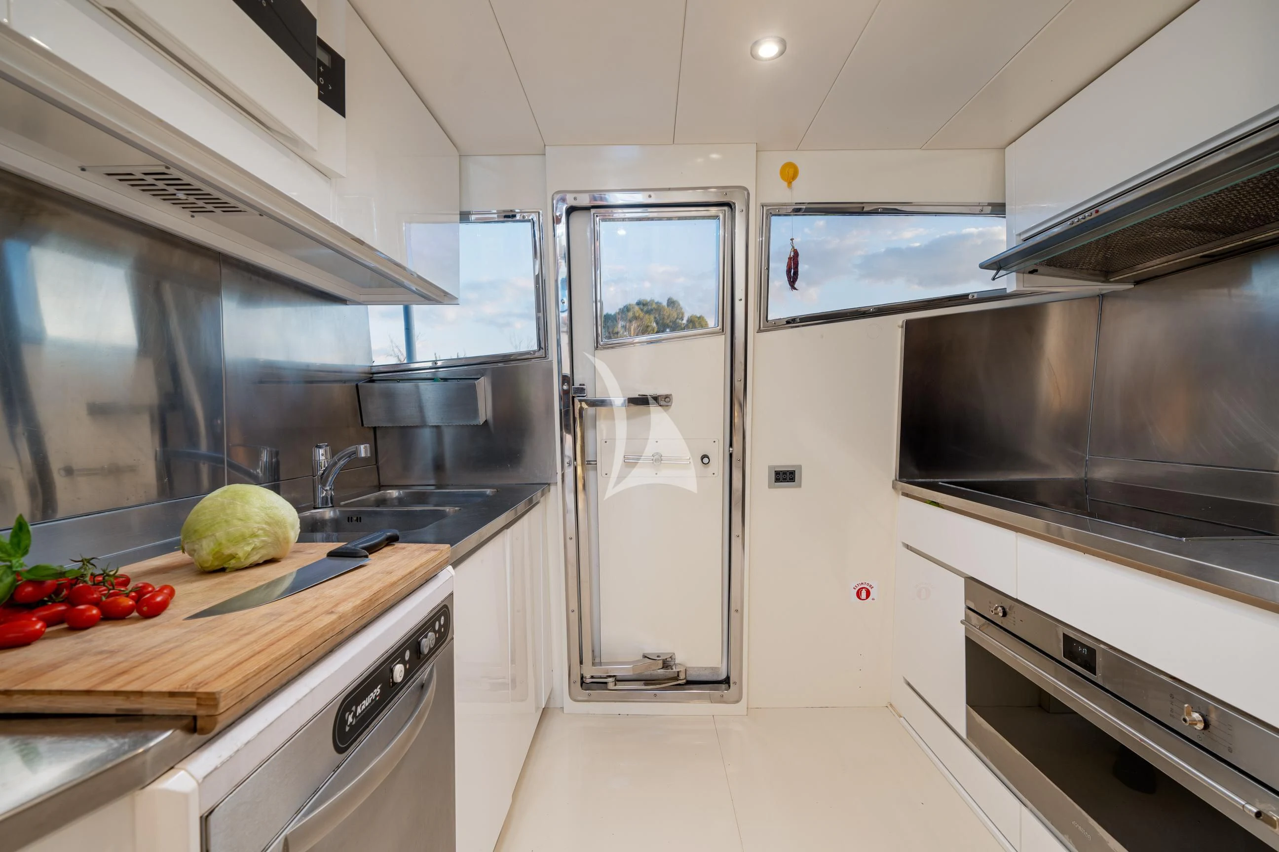a kitchen with stainless steel appliances aboard MINOU Yacht for Sale