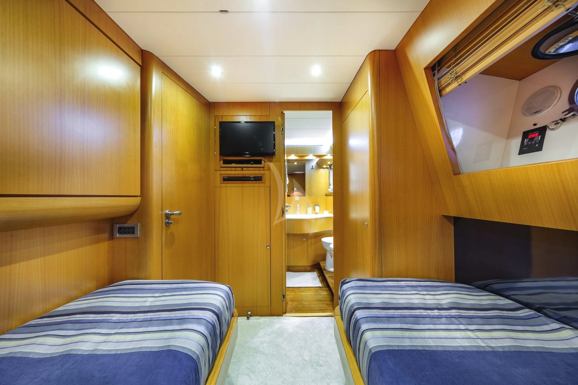 a room with a bed and a television aboard MINOU Yacht for Sale