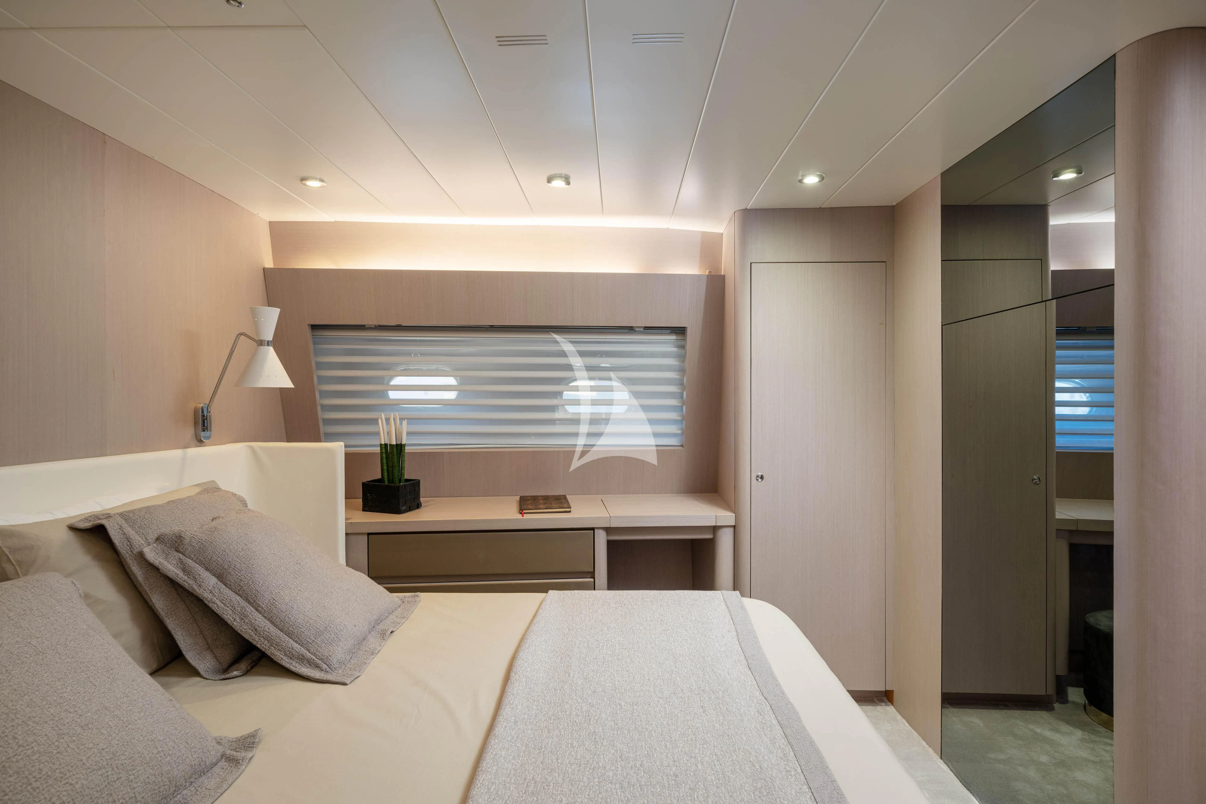 a room with a bed and a desk aboard MINOU Yacht for Sale