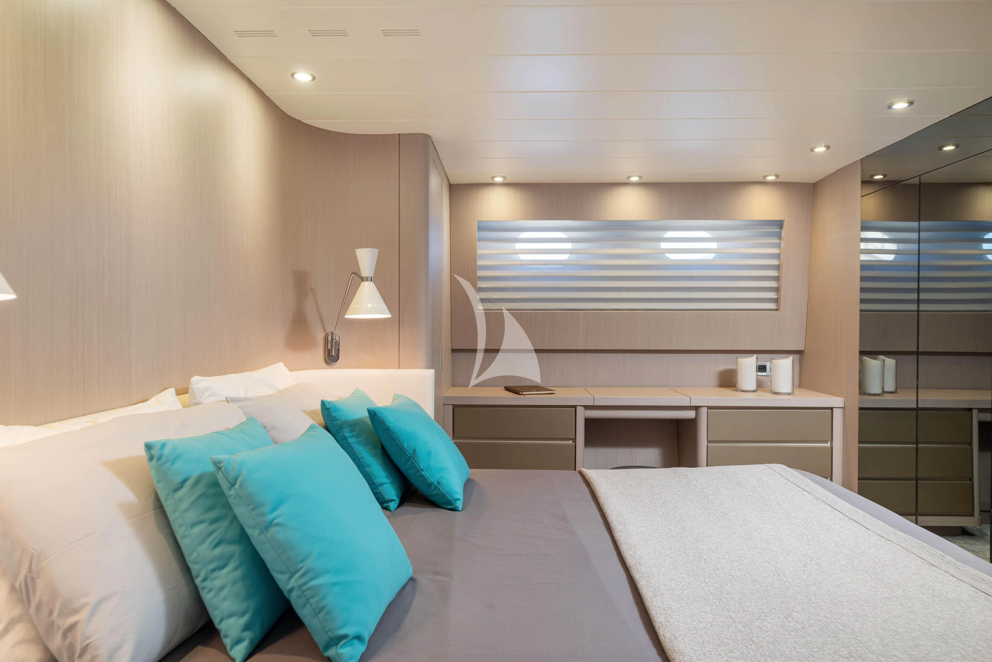 a room with a bed and a desk aboard MINOU Yacht for Sale