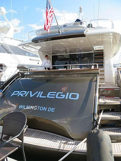 a boat with a person standing on the deck aboard PRIVILEGIO Yacht for Sale