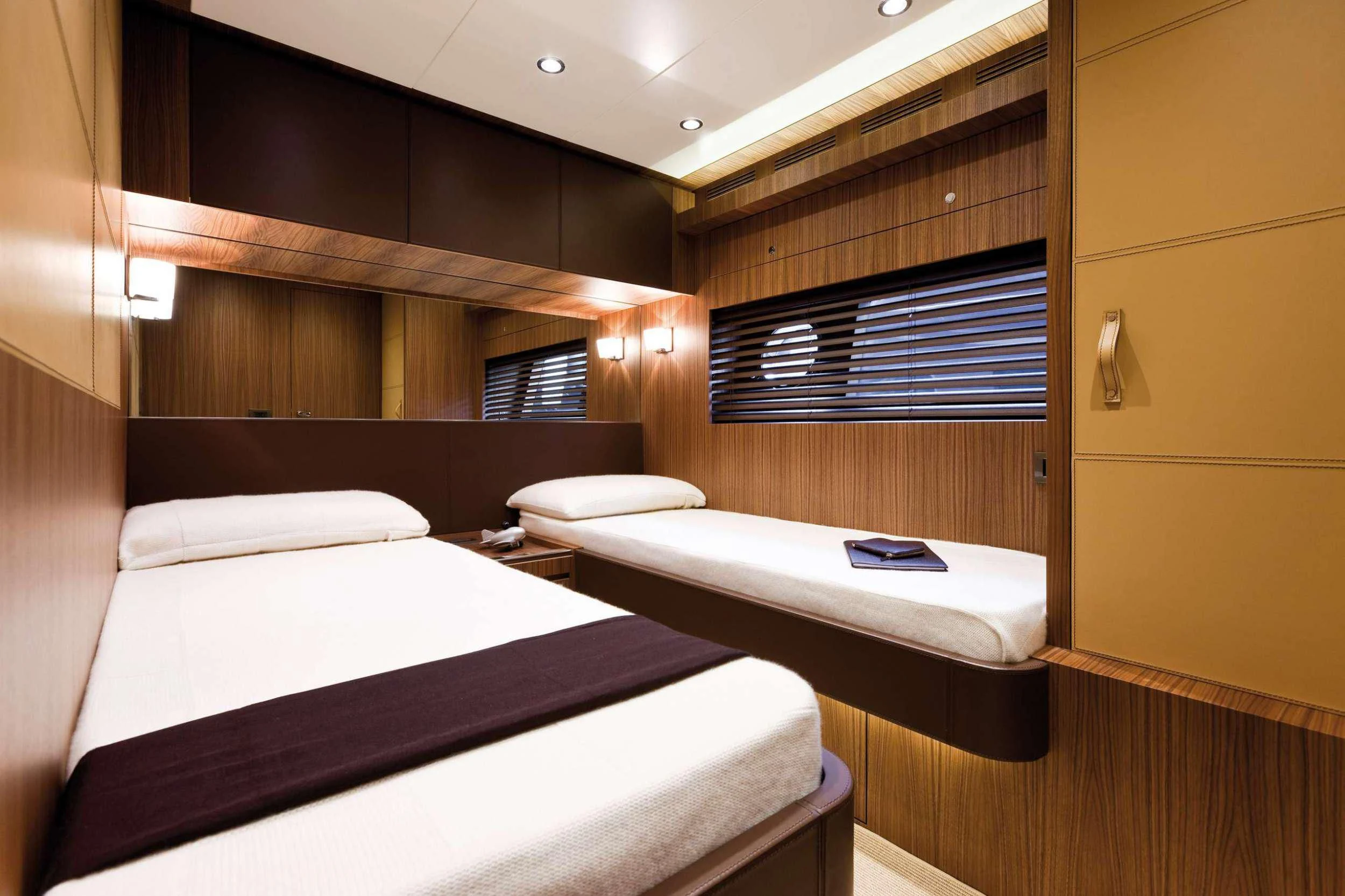 a room with two beds aboard PRIVILEGIO Yacht for Sale
