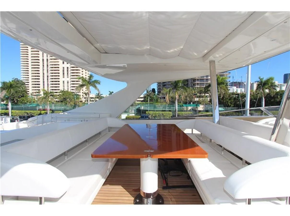 a pool with a table and chairs aboard PRIVILEGIO Yacht for Sale