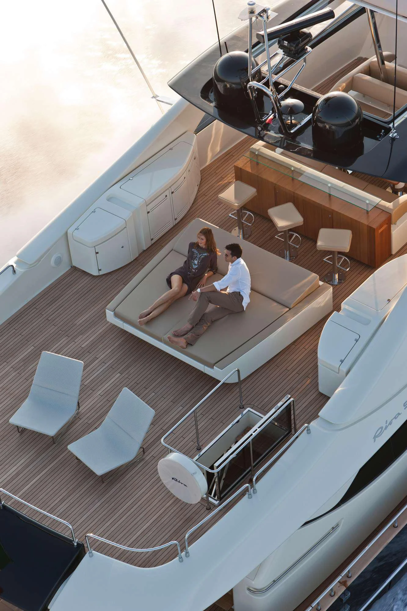 a group of people sitting on a couch aboard PRIVILEGIO Yacht for Sale