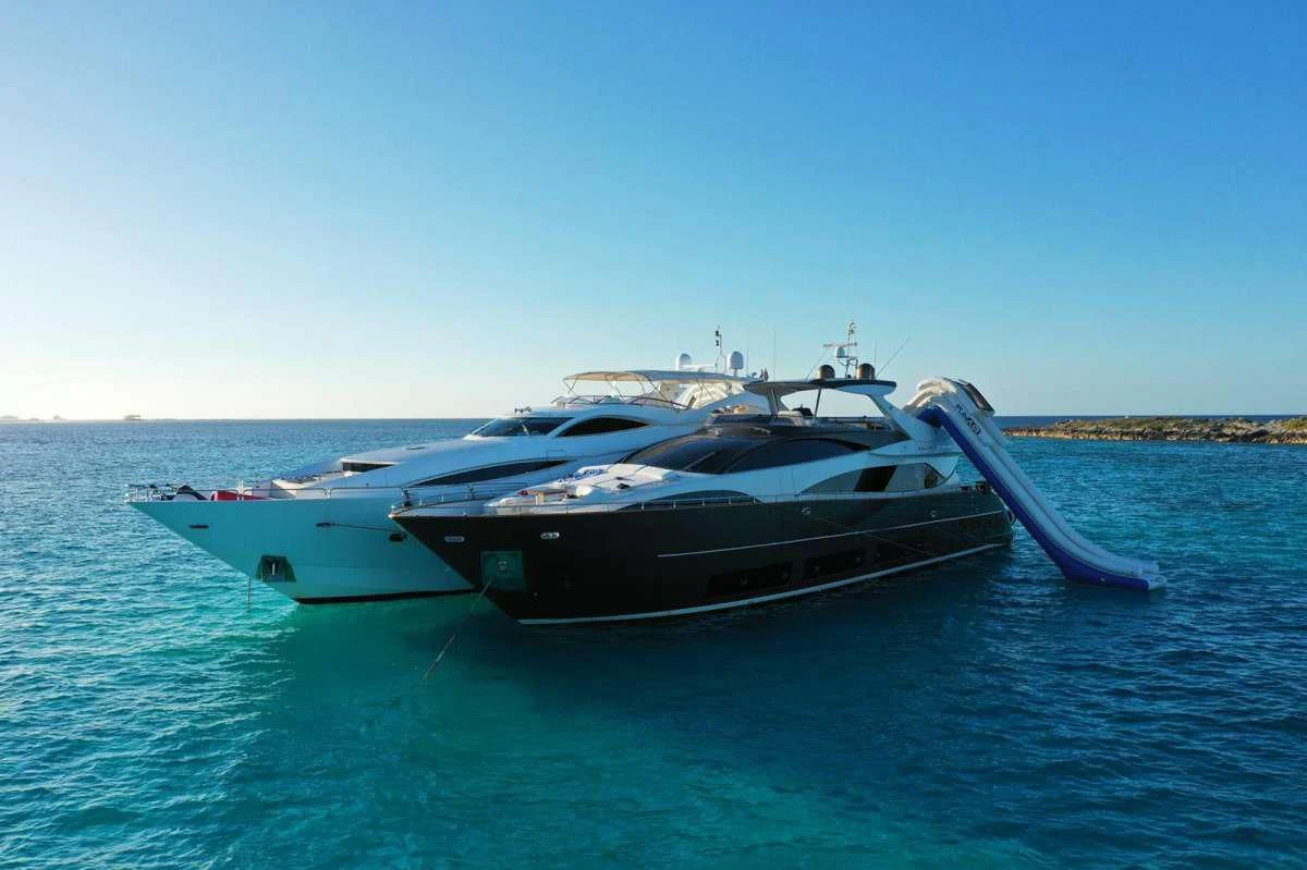 a couple of boats in the water aboard PRIVILEGIO Yacht for Sale