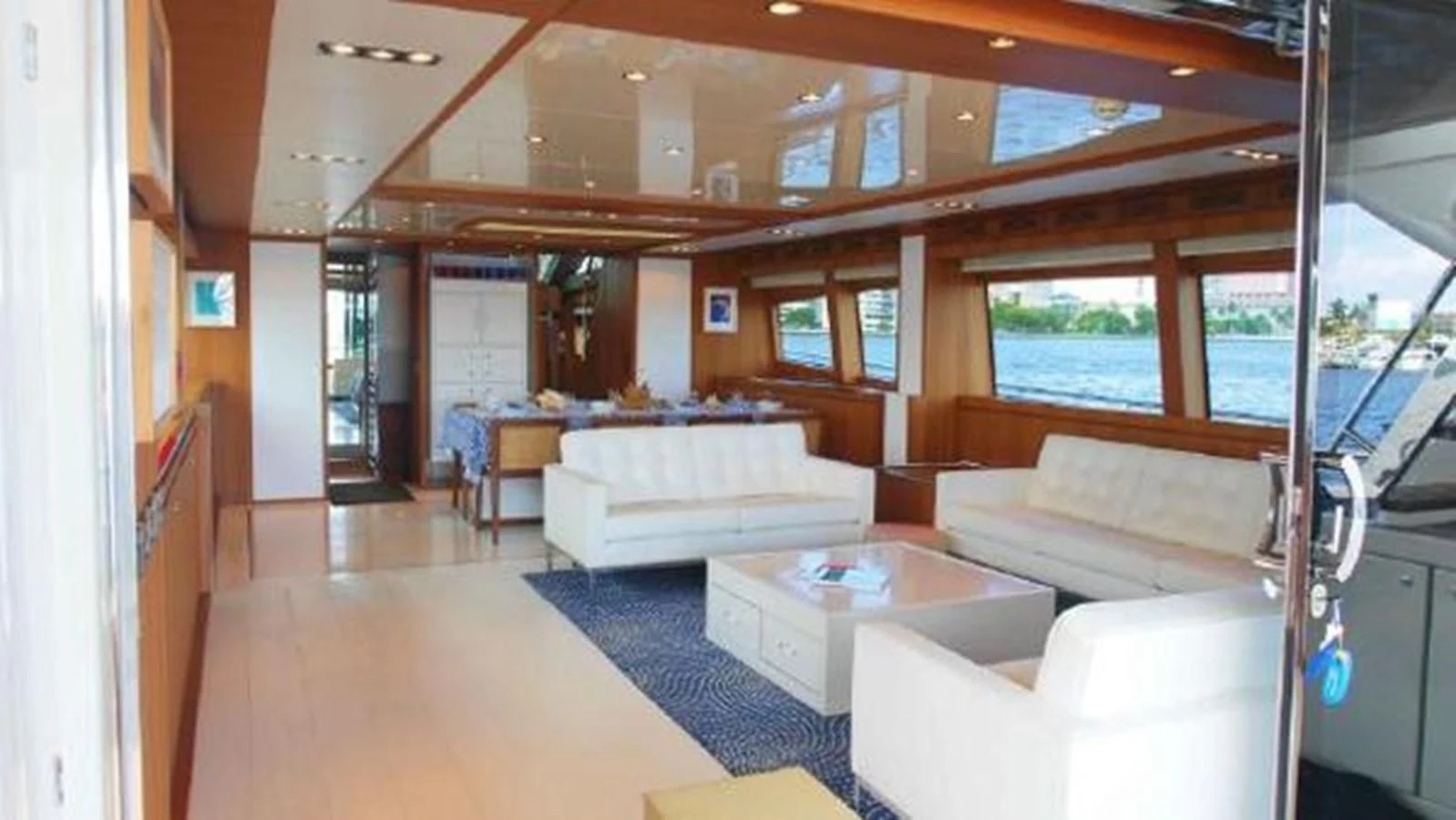a living room with a large window aboard PRIVILEGIO Yacht for Sale