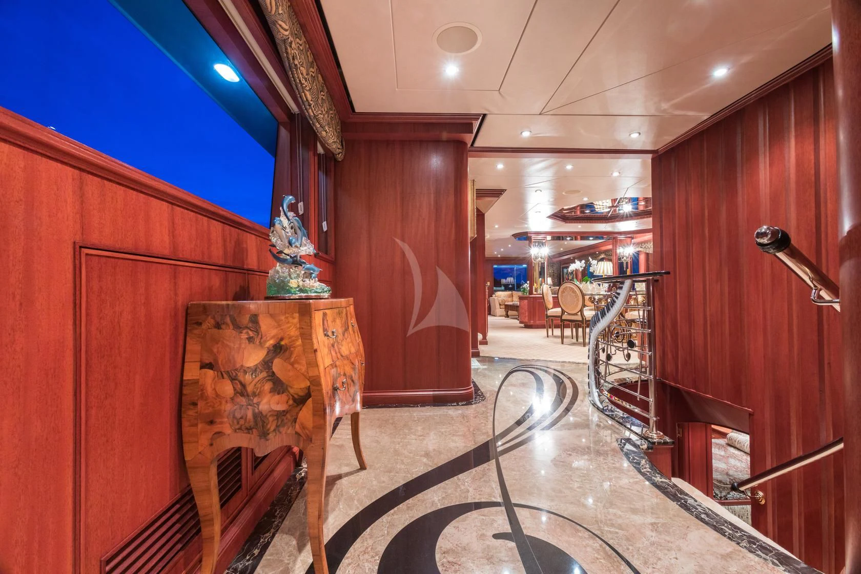 a room with a fireplace and a table aboard SHOGUN Yacht for Sale