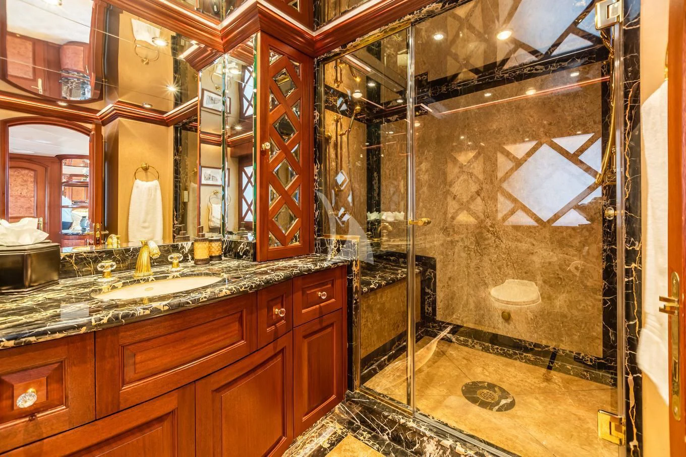 a bathroom with a large mirror aboard SHOGUN Yacht for Sale