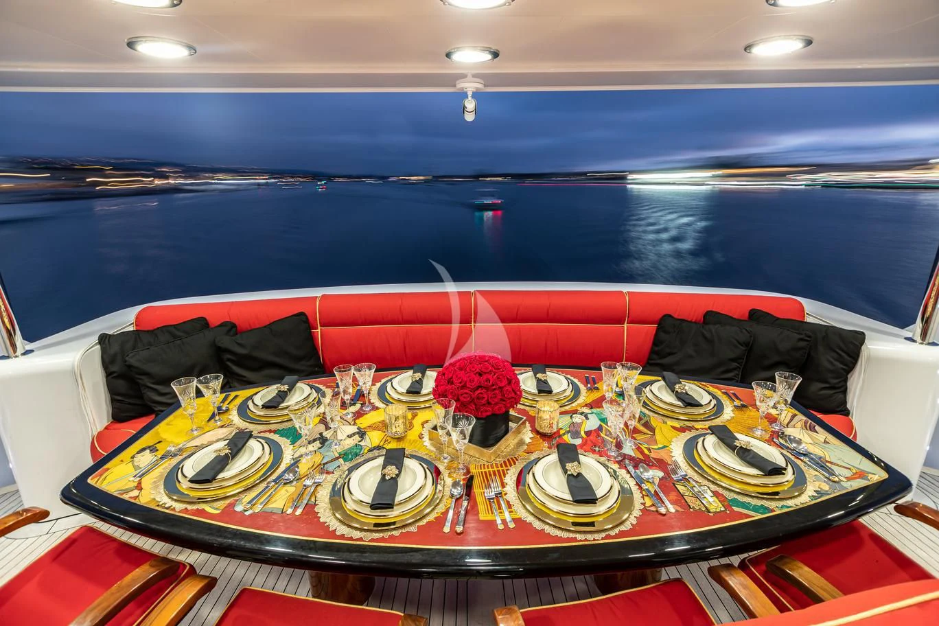 a table with plates and cups on it aboard SHOGUN Yacht for Sale