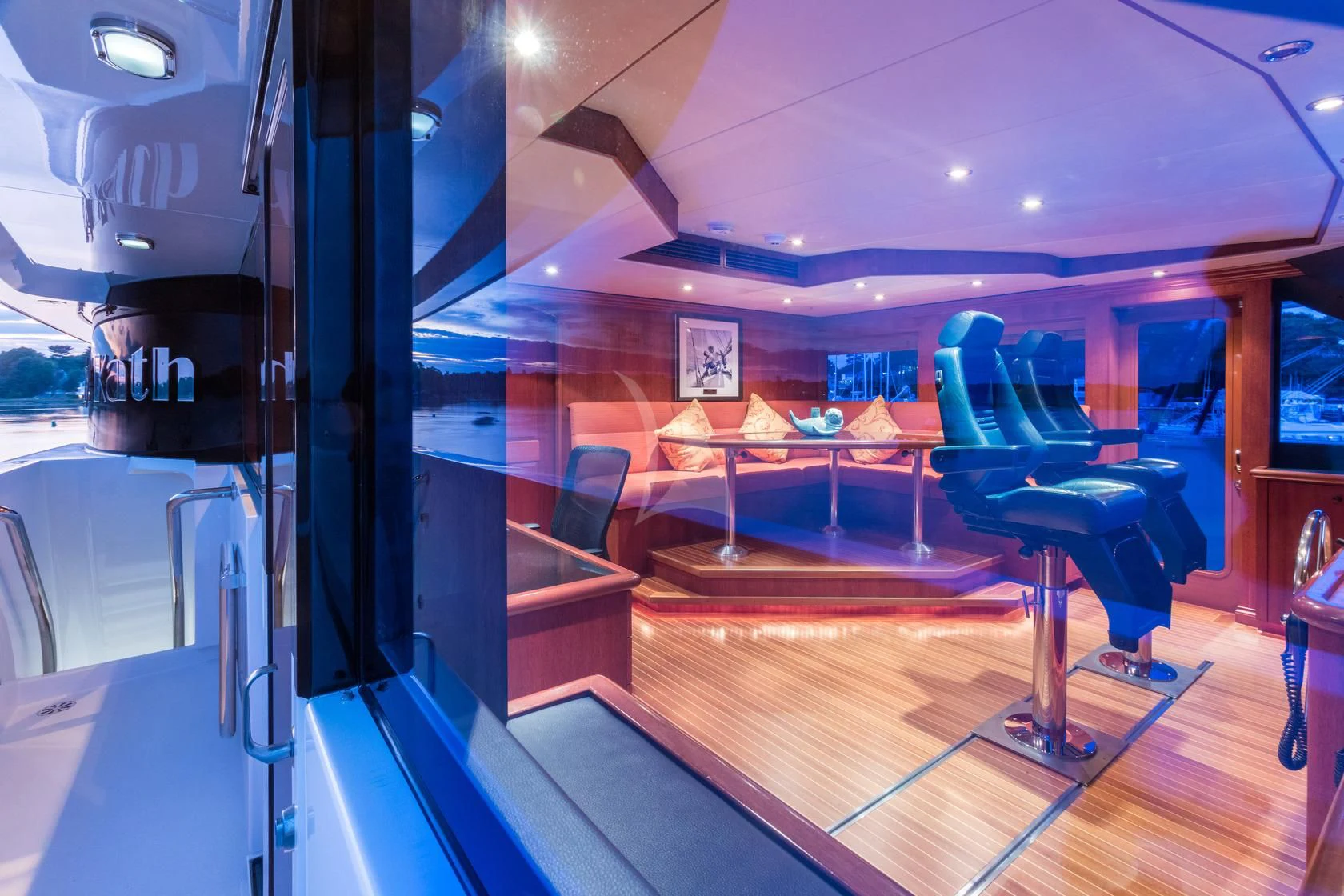 a room with a table and chairs aboard SHOGUN Yacht for Sale