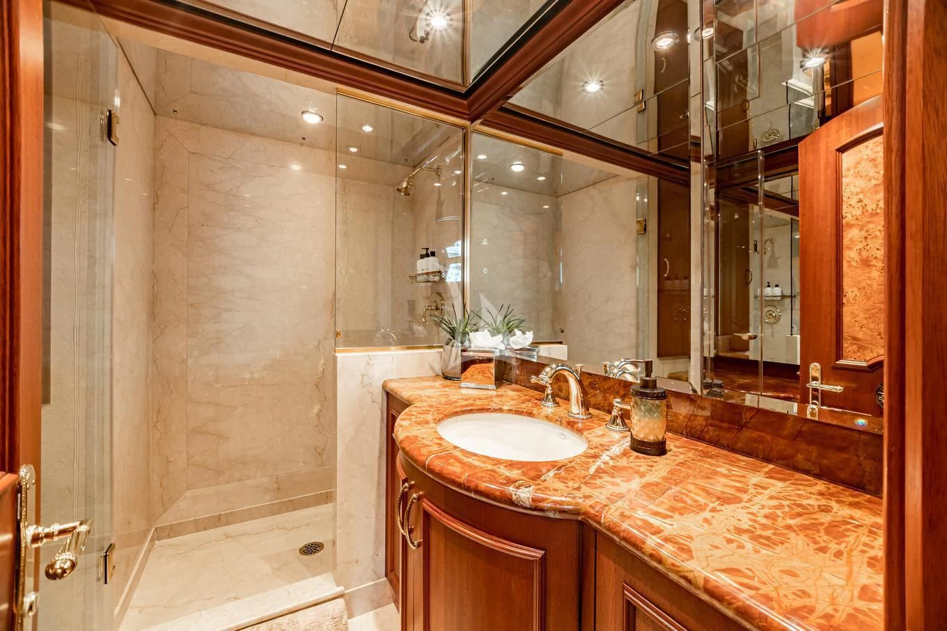 a bathroom with a countertop sink and a shower aboard SHOGUN Yacht for Sale