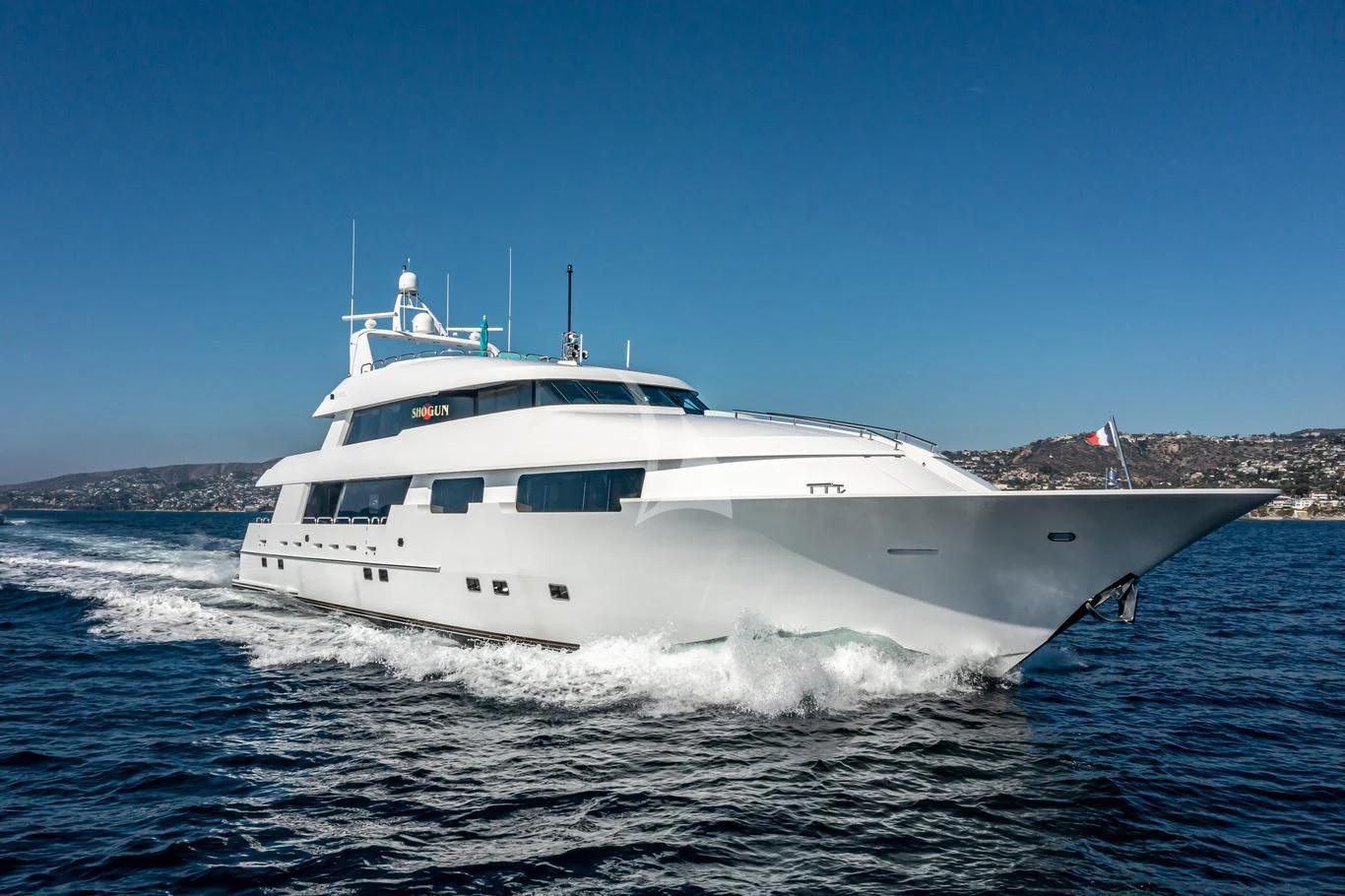 a white yacht on the water aboard SHOGUN Yacht for Sale