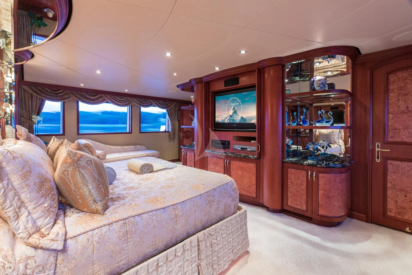 a living room with a couch and tv aboard SHOGUN Yacht for Sale