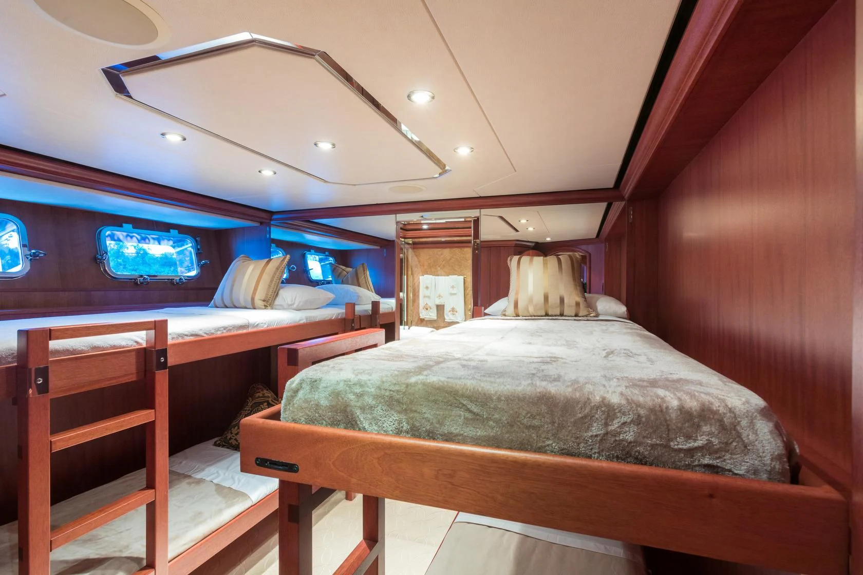 a room with a bed and a television aboard SHOGUN Yacht for Sale