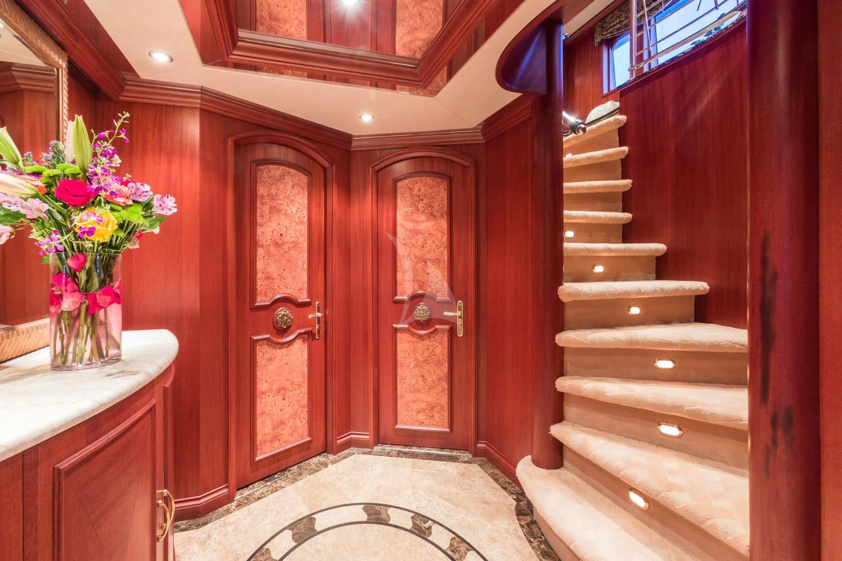 a wood door and a rug in a room with a rug and flowers aboard SHOGUN Yacht for Sale