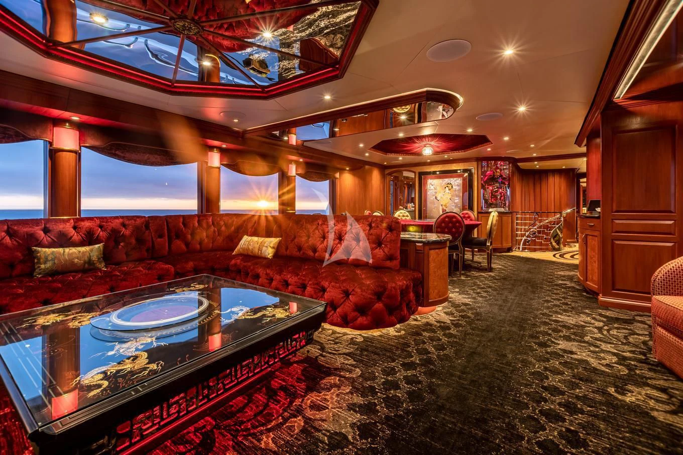 a living room with a large chandelier aboard SHOGUN Yacht for Sale