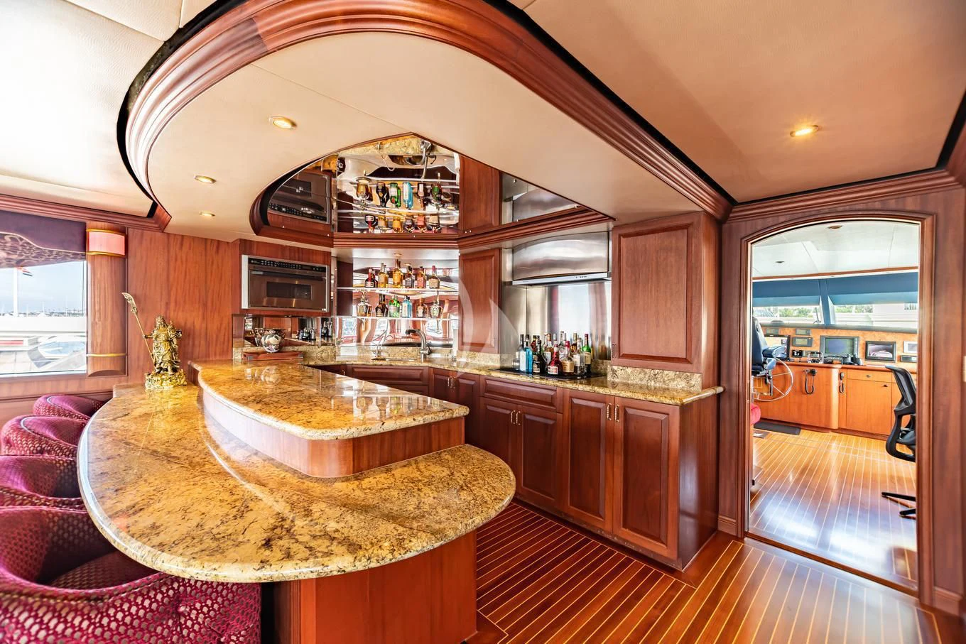 a kitchen with a bar and a bar aboard SHOGUN Yacht for Sale