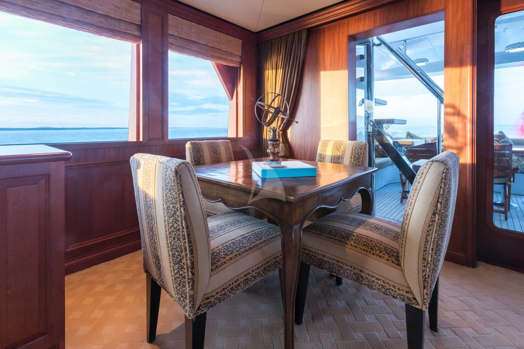 a table and chairs in a room aboard SHOGUN Yacht for Sale