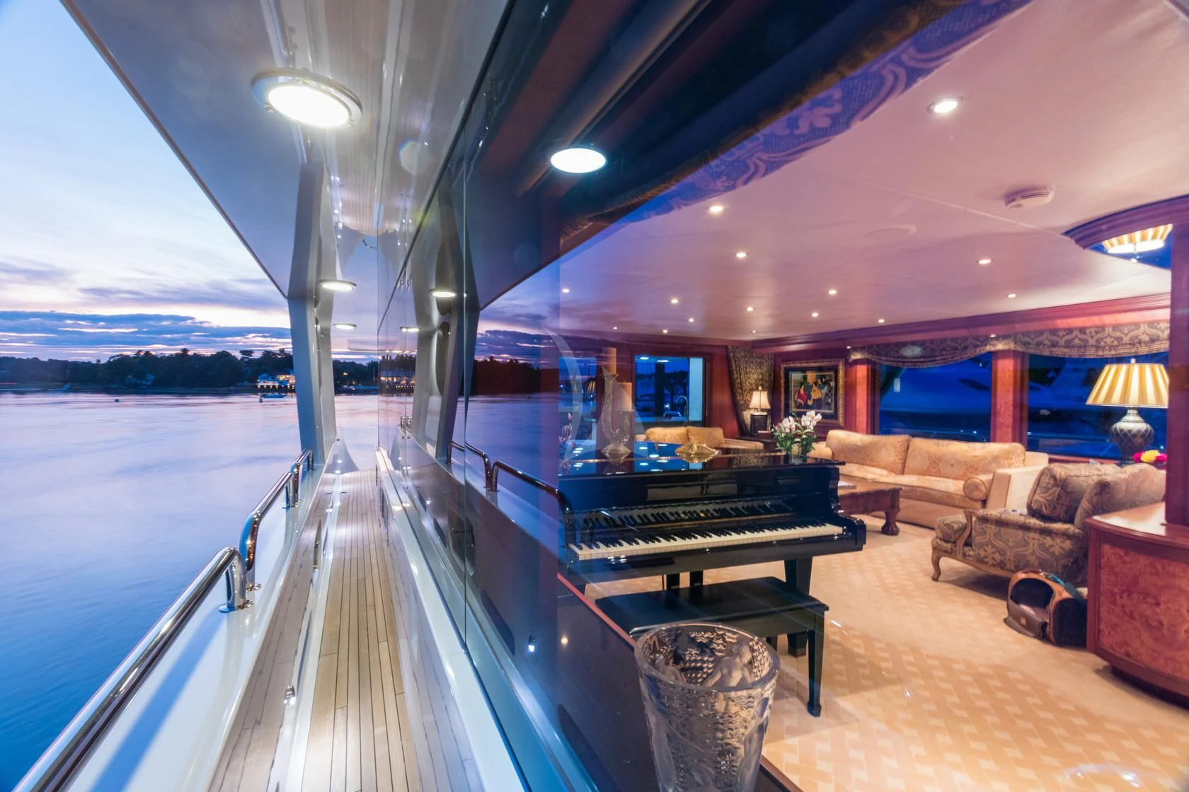 a large room with a pool table and couches aboard SHOGUN Yacht for Sale