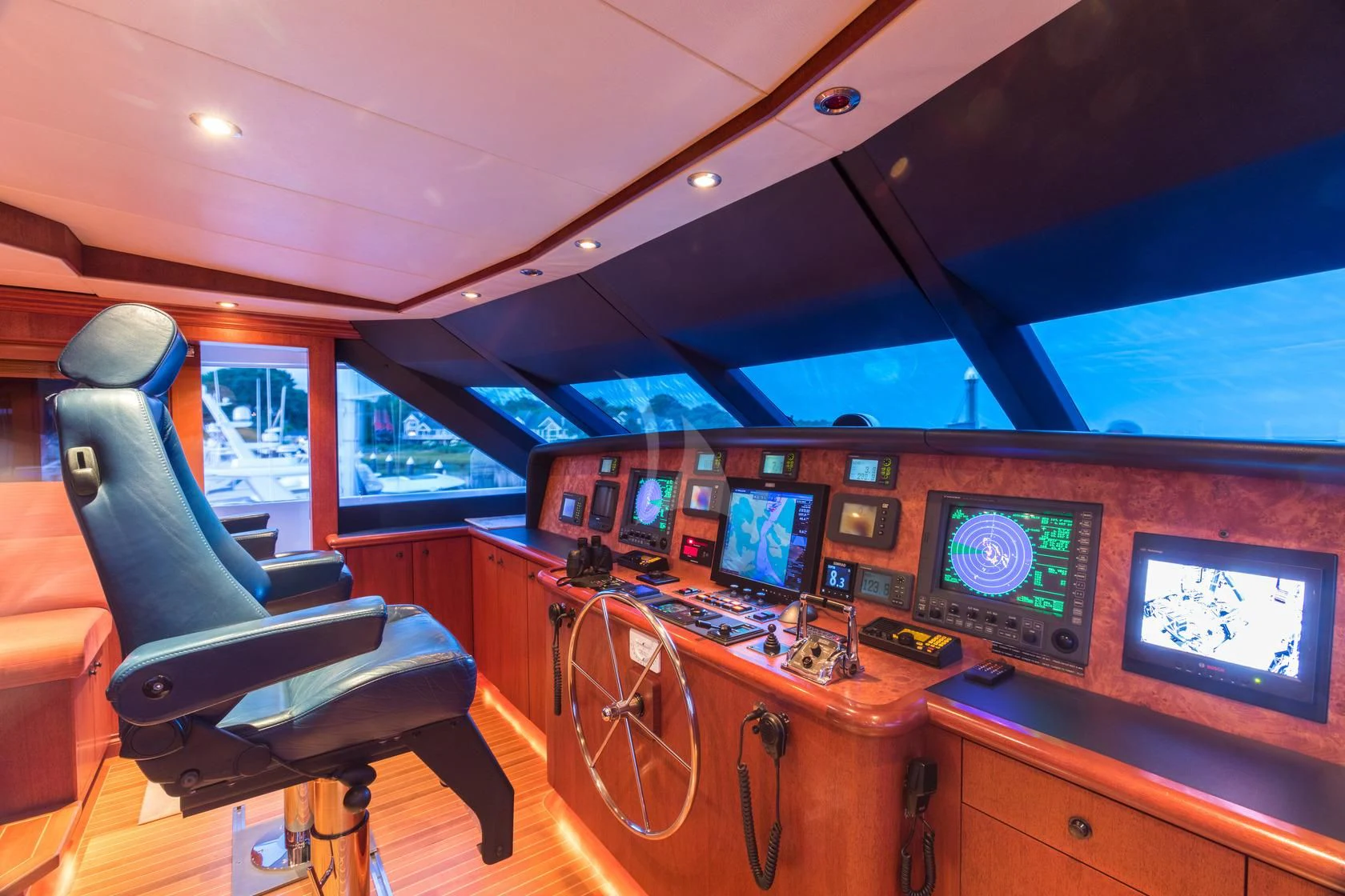 inside of a vehicle with a desk and computer screens aboard SHOGUN Yacht for Sale