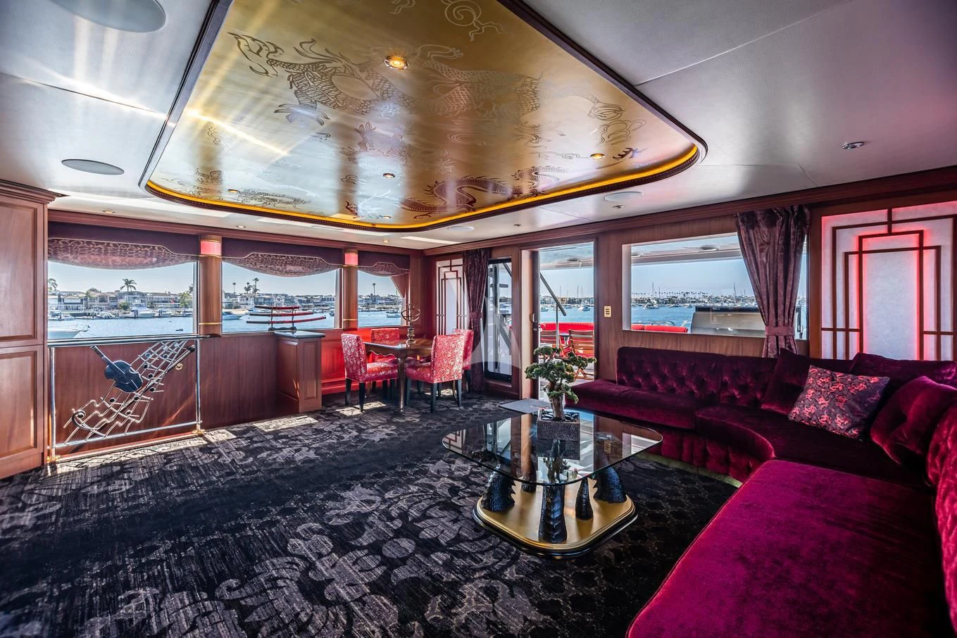 a room with a table and couches aboard SHOGUN Yacht for Sale