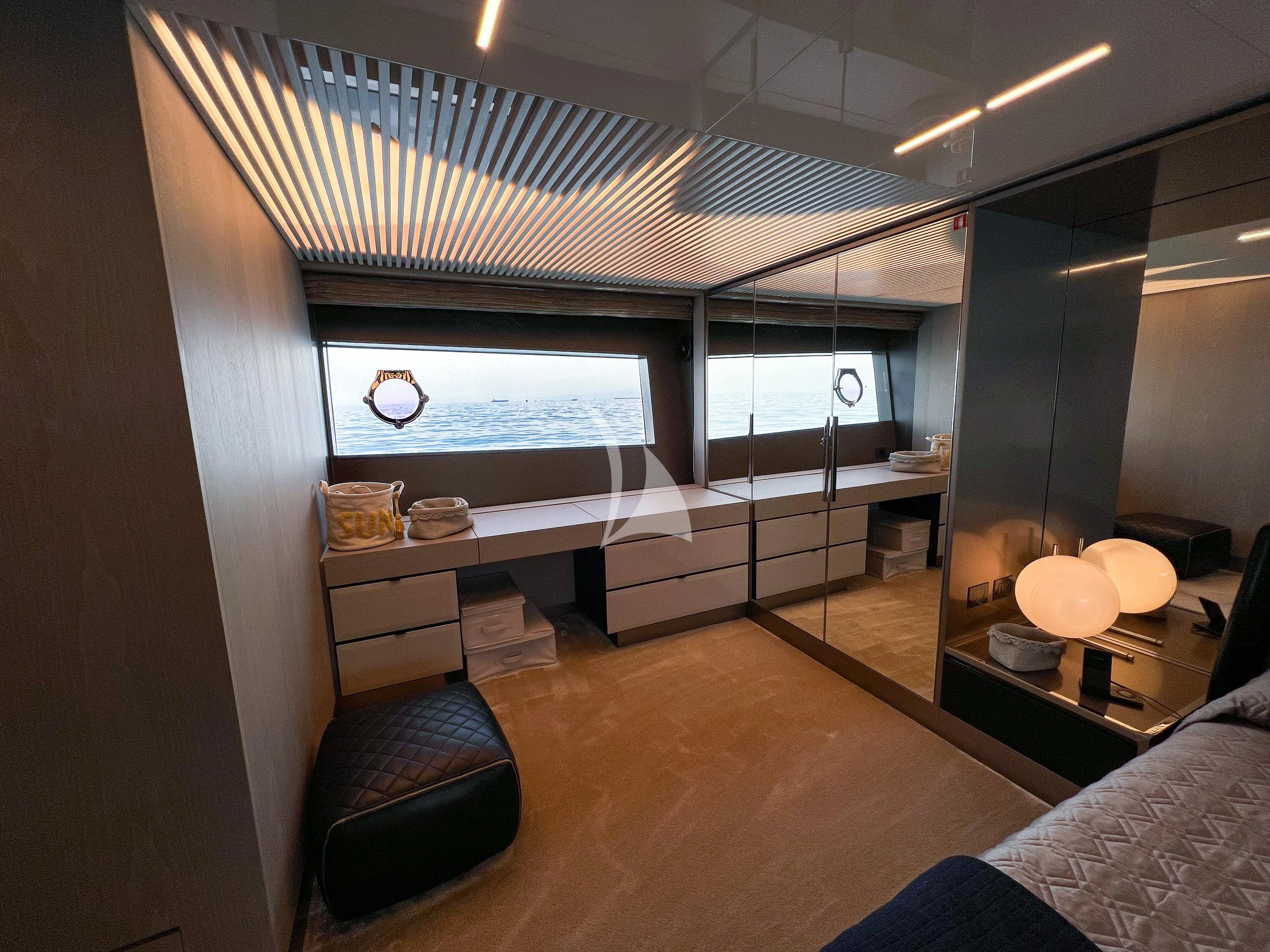 a room with a tv and a bed aboard E3 Yacht for Sale