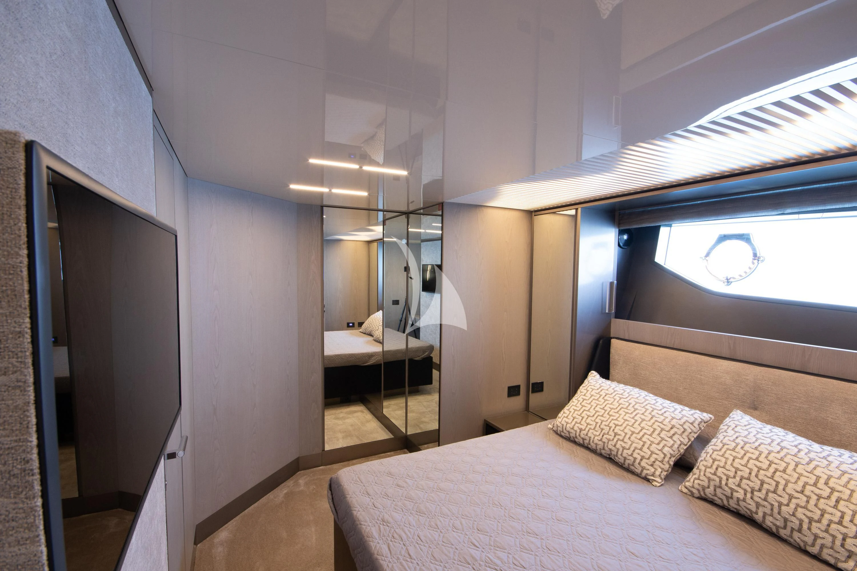 a bedroom with a bed and a window aboard E3 Yacht for Sale
