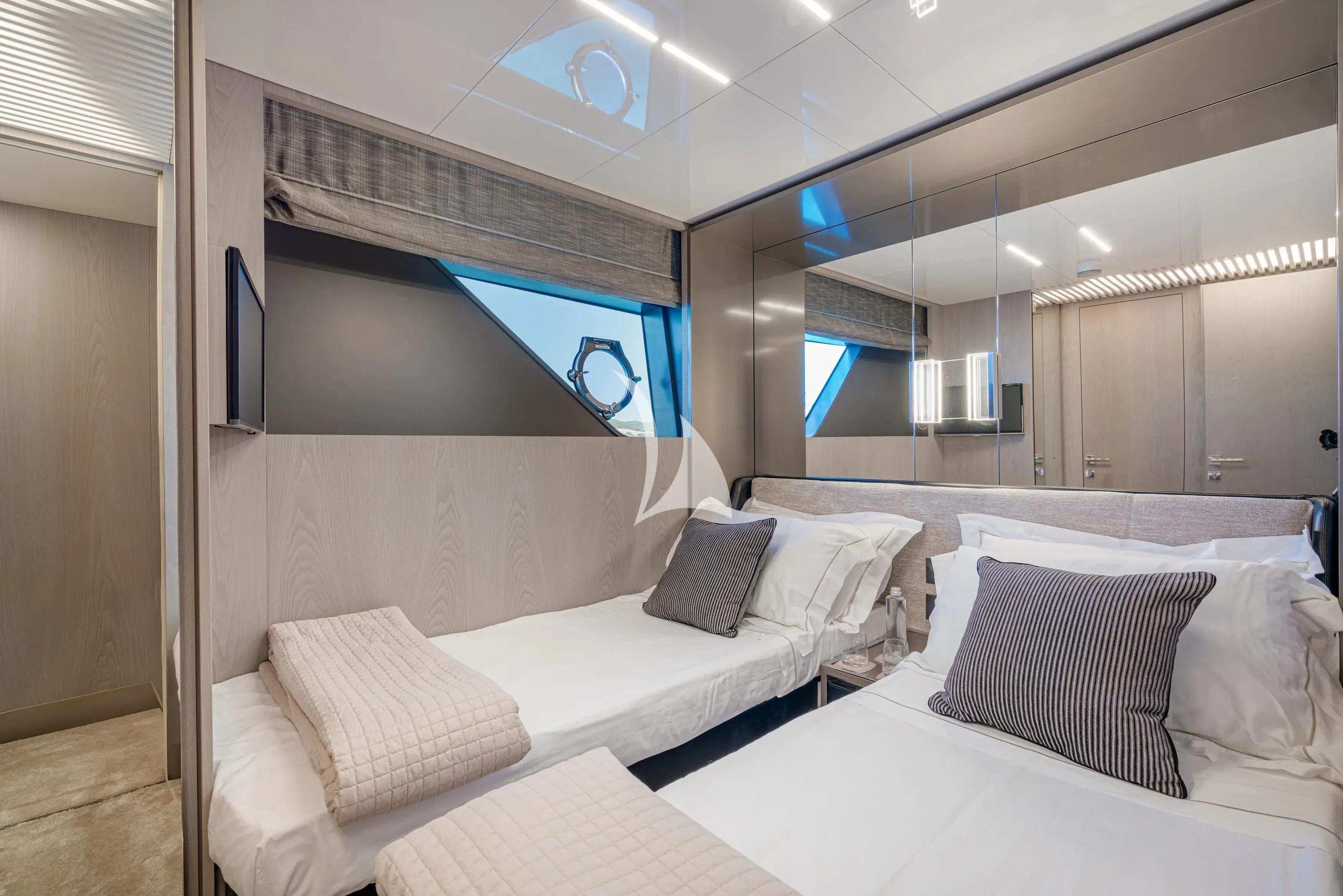 a room with two beds aboard E3 Yacht for Sale