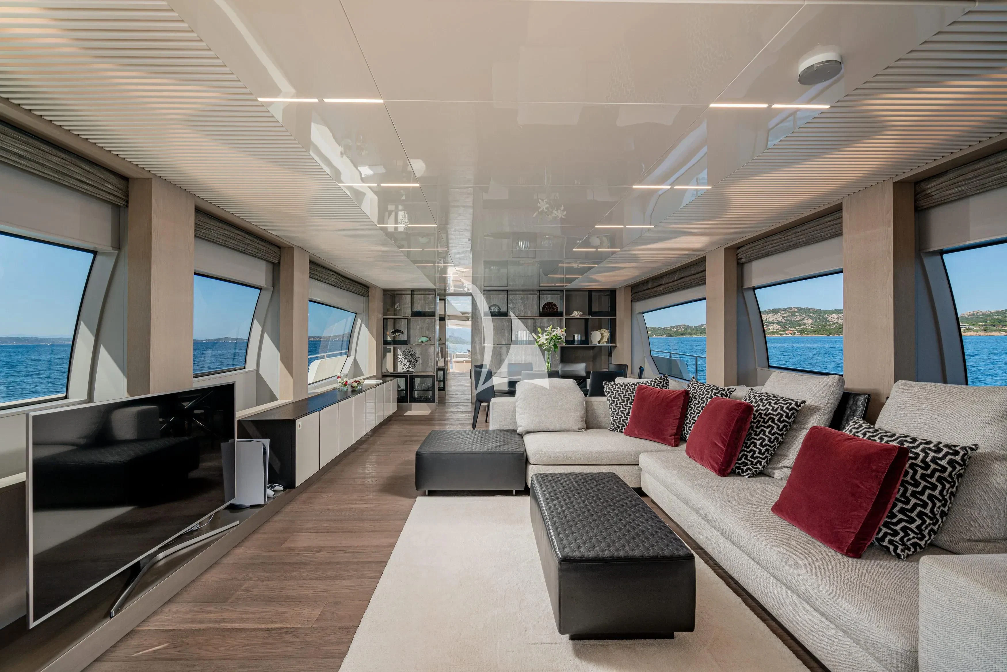 a living room with a large window aboard E3 Yacht for Sale