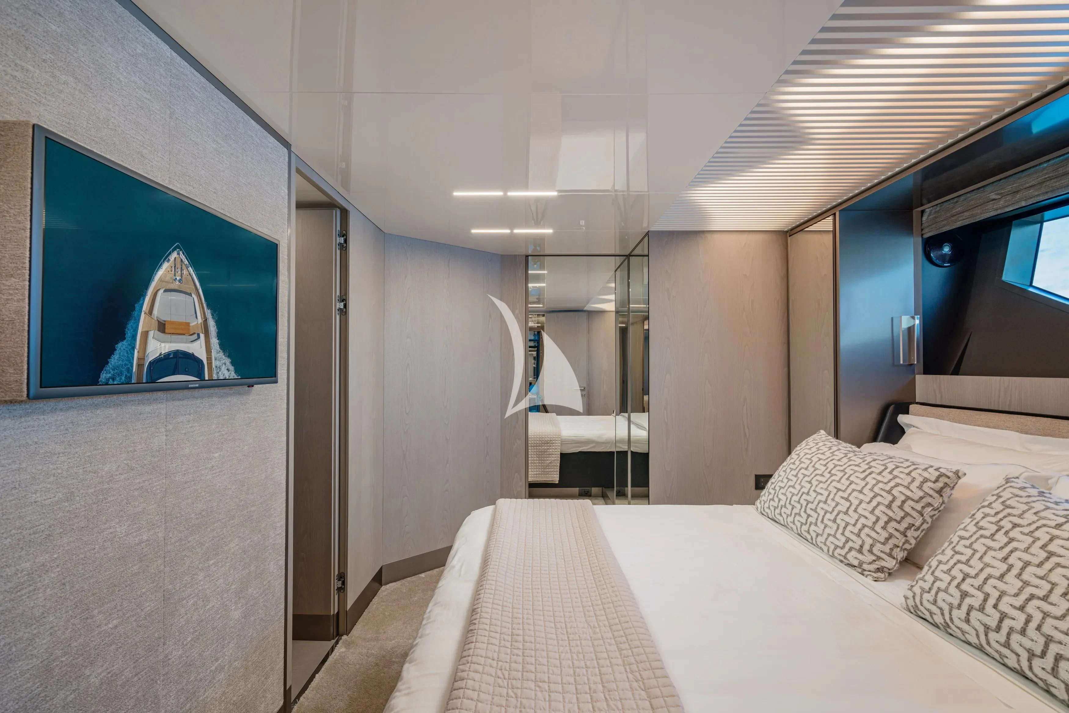 a room with a bed and a mirror aboard E3 Yacht for Sale