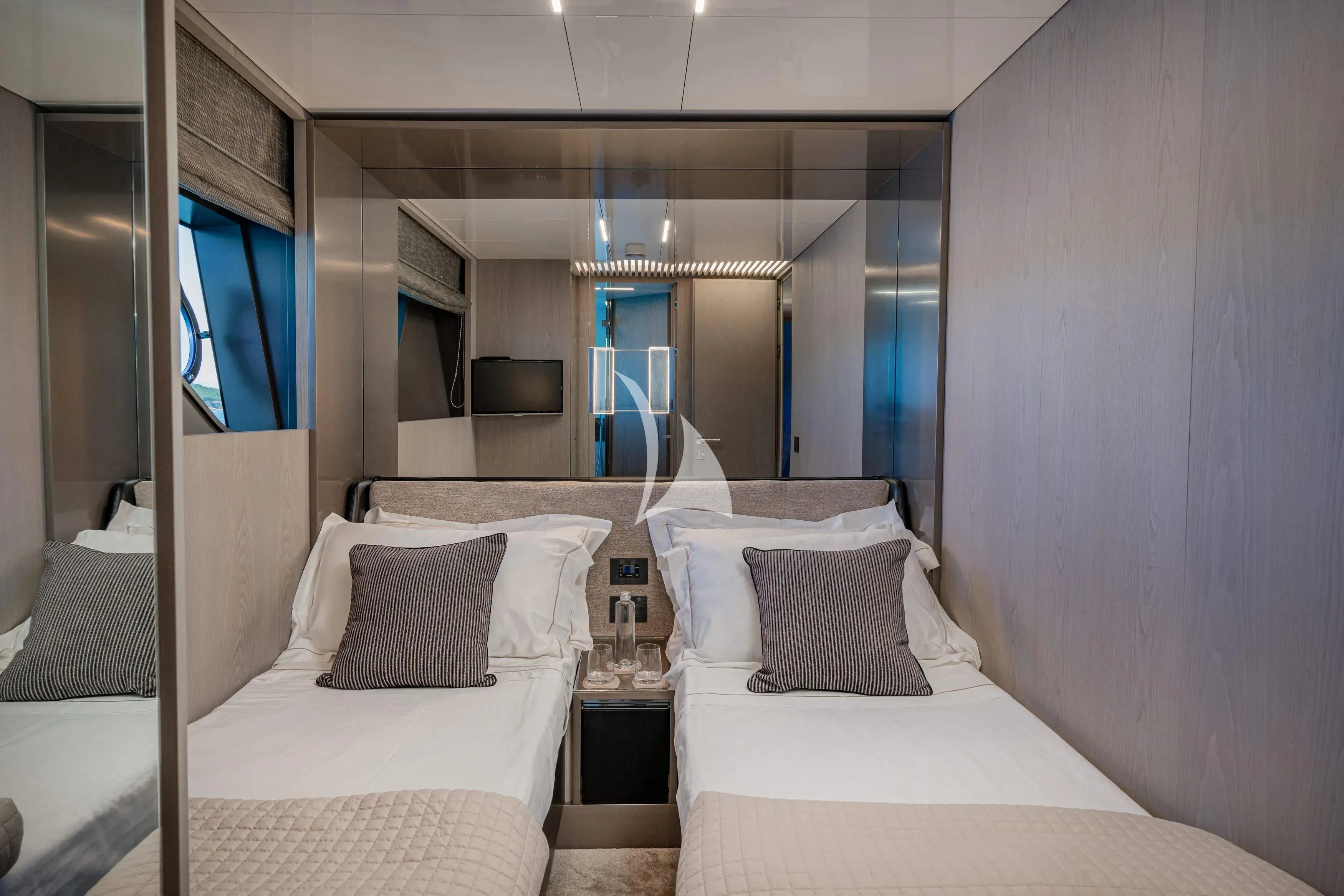 a room with two beds aboard E3 Yacht for Sale