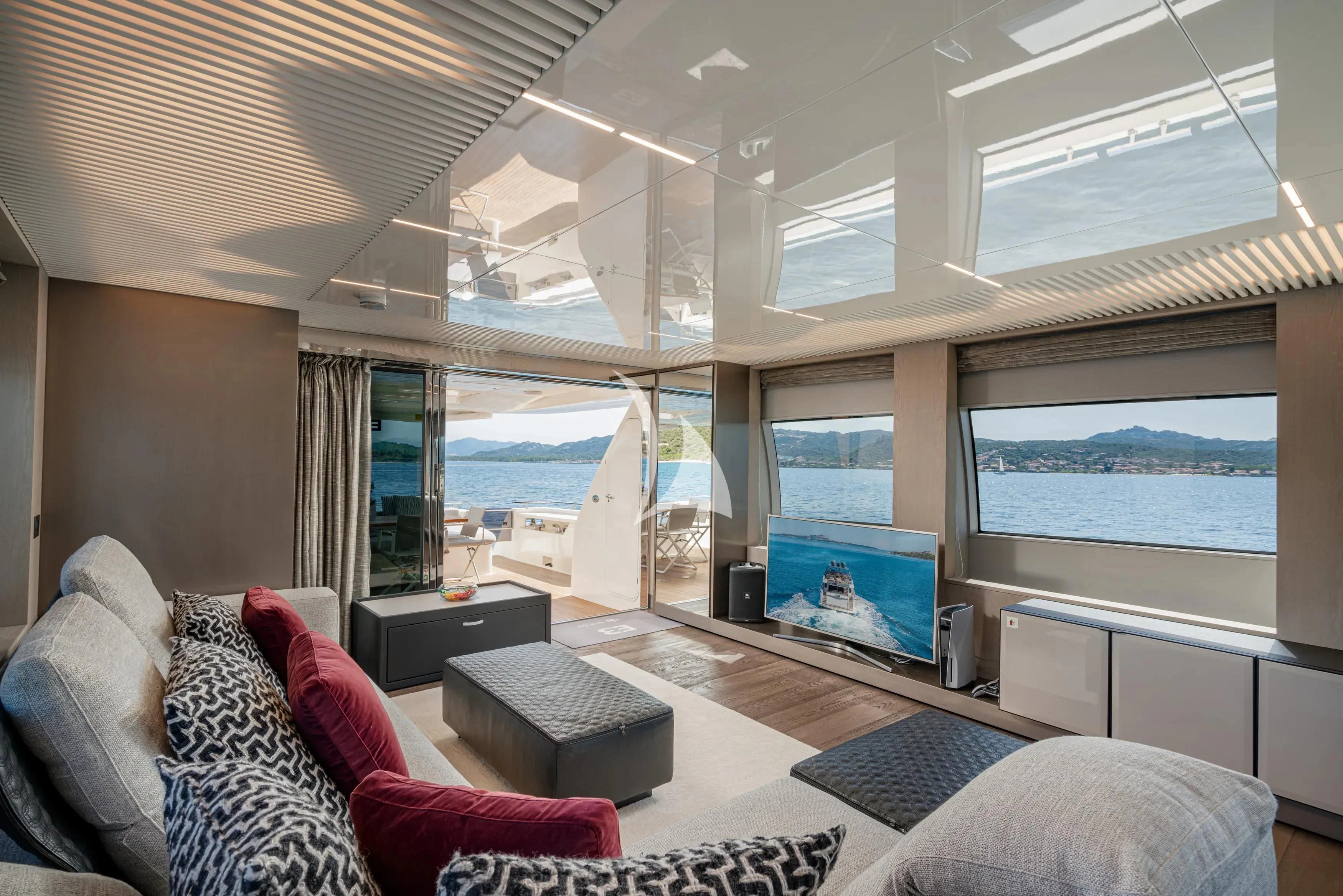 a living room with a large window aboard E3 Yacht for Sale