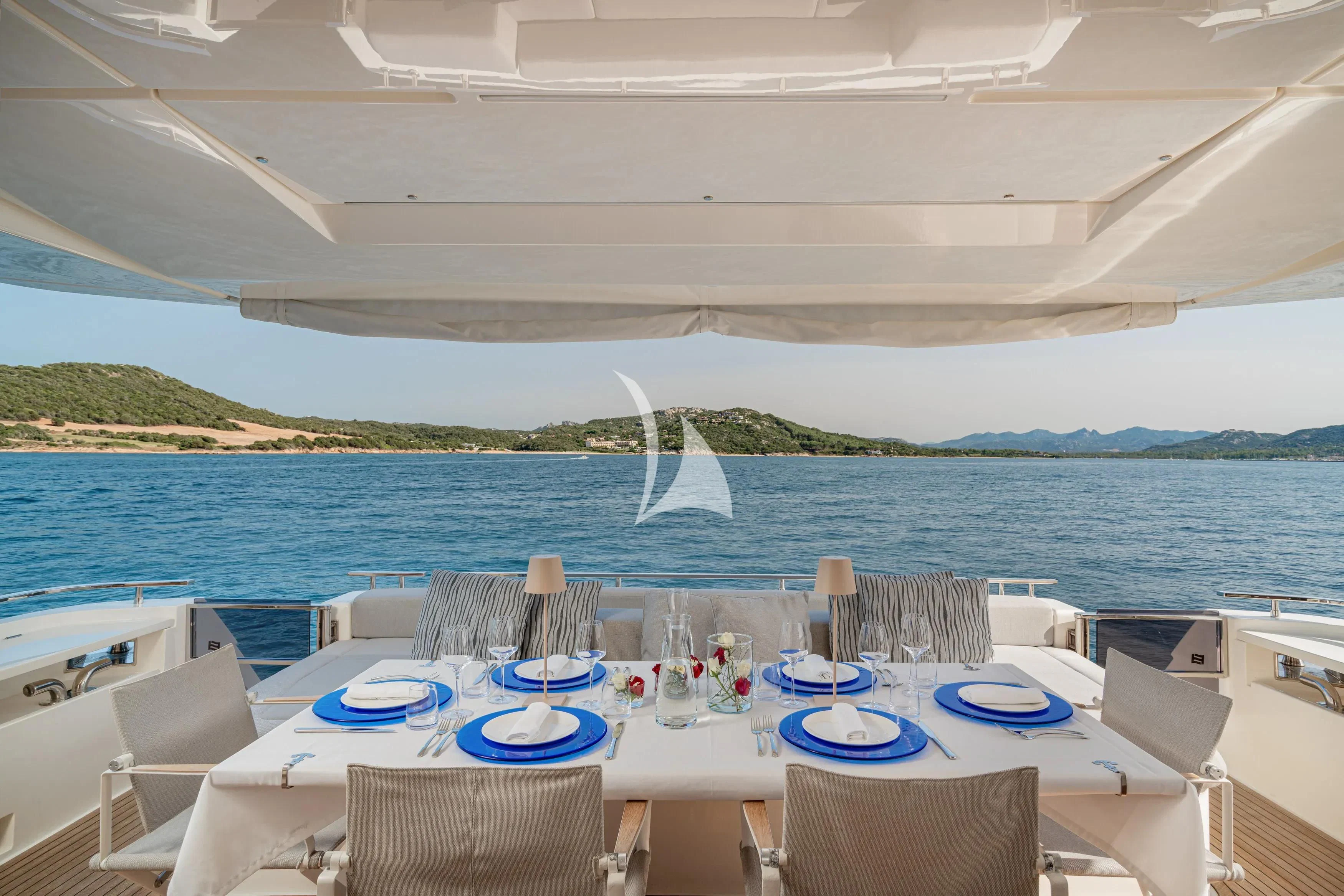 a table set for a dinner on a boat aboard E3 Yacht for Sale
