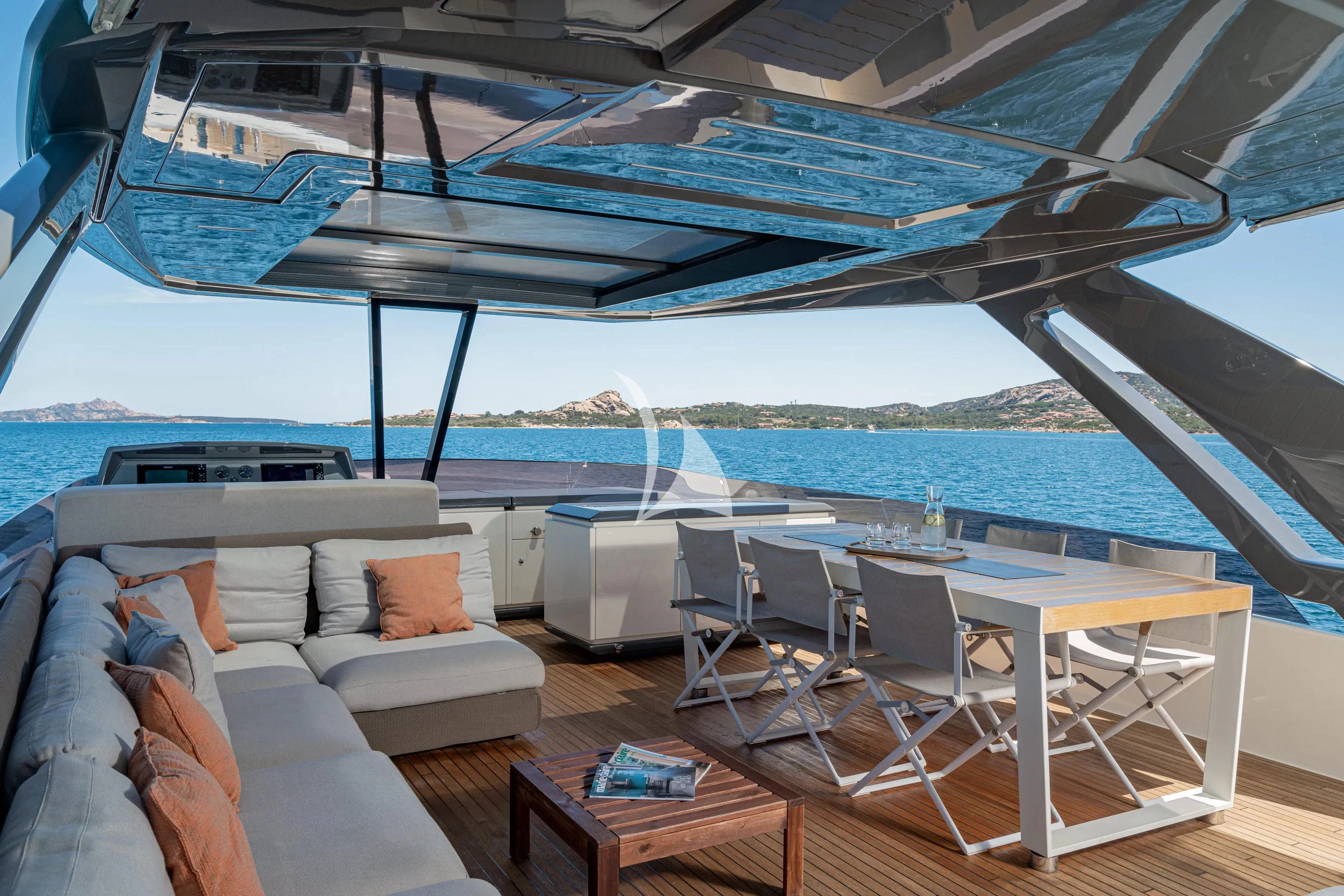 a large lounge area with a large swimming pool and a large deck aboard E3 Yacht for Sale
