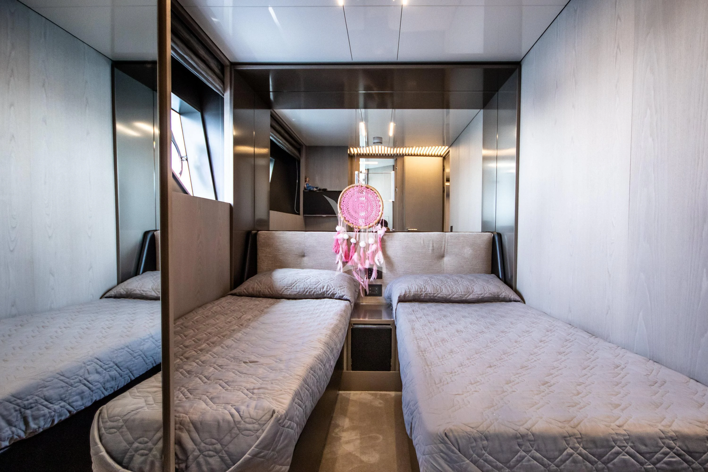 a room with two beds aboard E3 Yacht for Sale