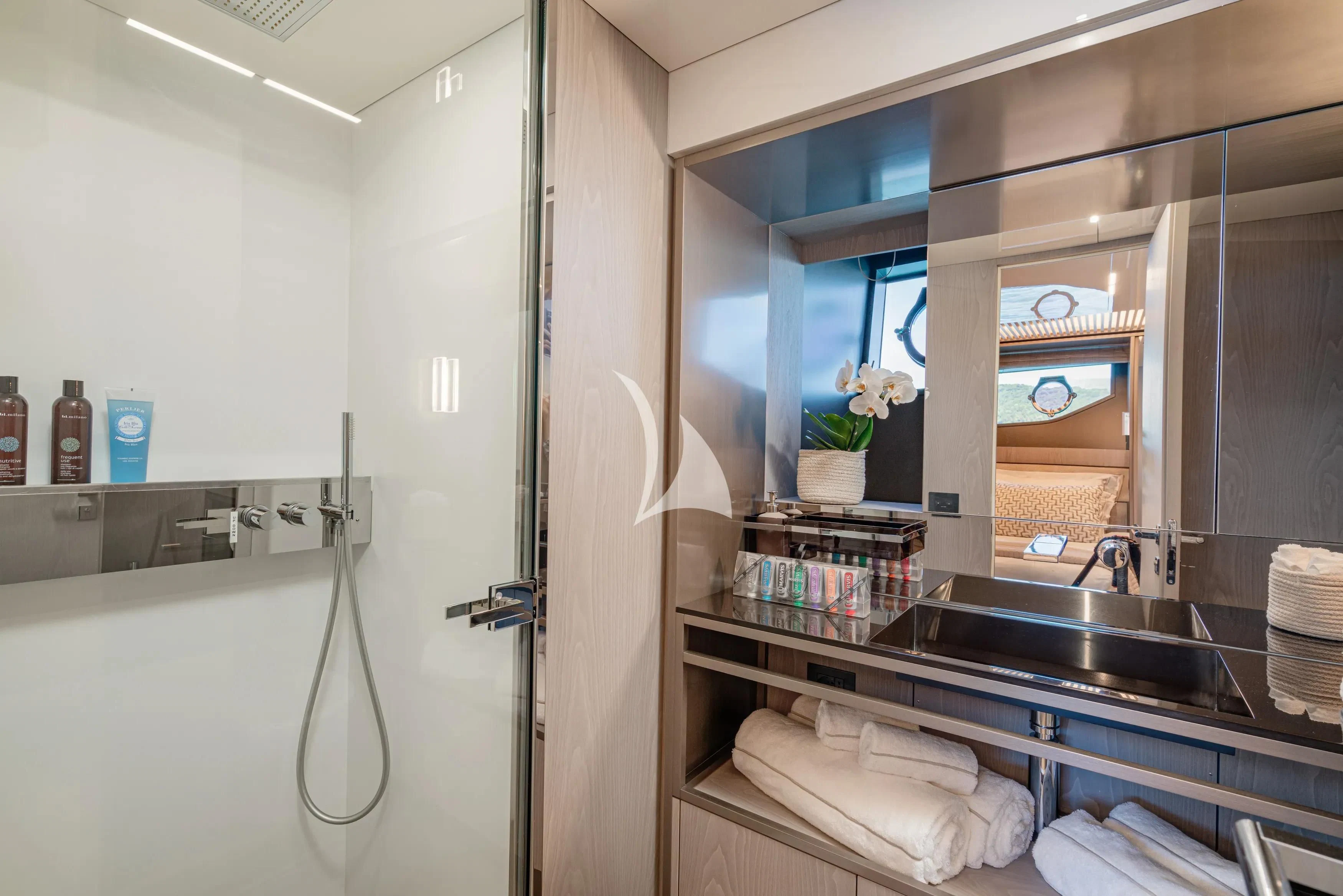 a bathroom with a sink and a mirror aboard E3 Yacht for Sale
