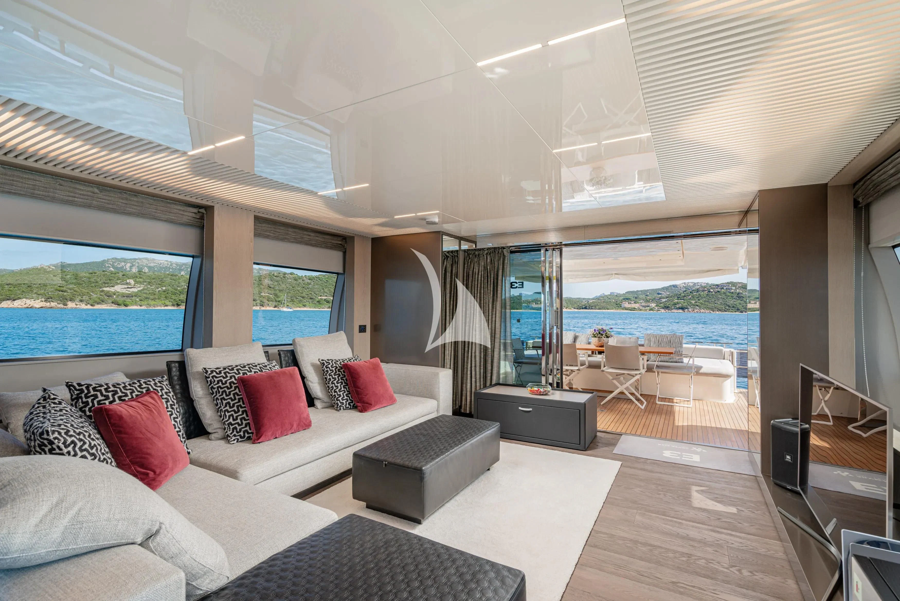 a living room with a large window aboard E3 Yacht for Sale