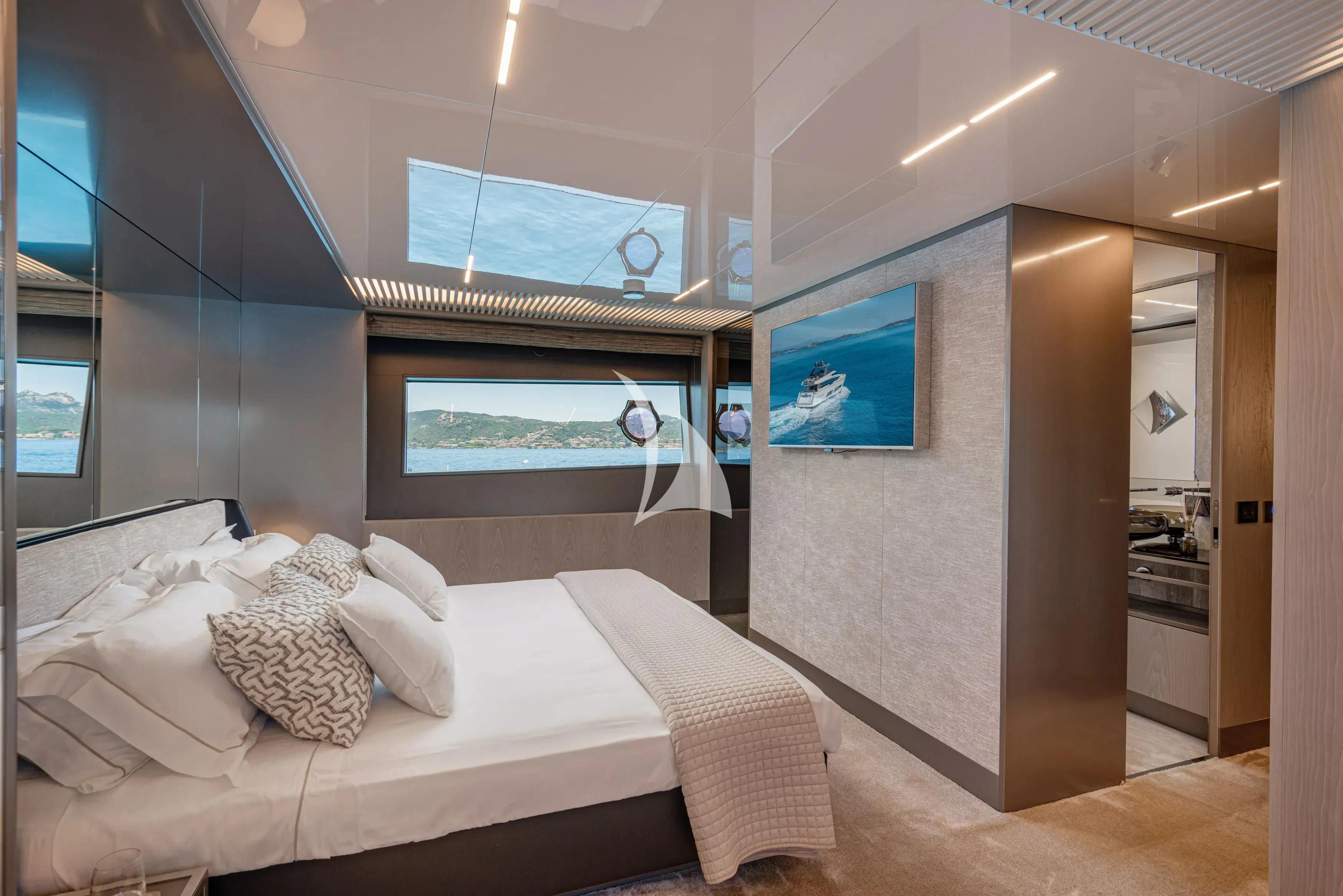 a room with a bed and a television aboard E3 Yacht for Sale