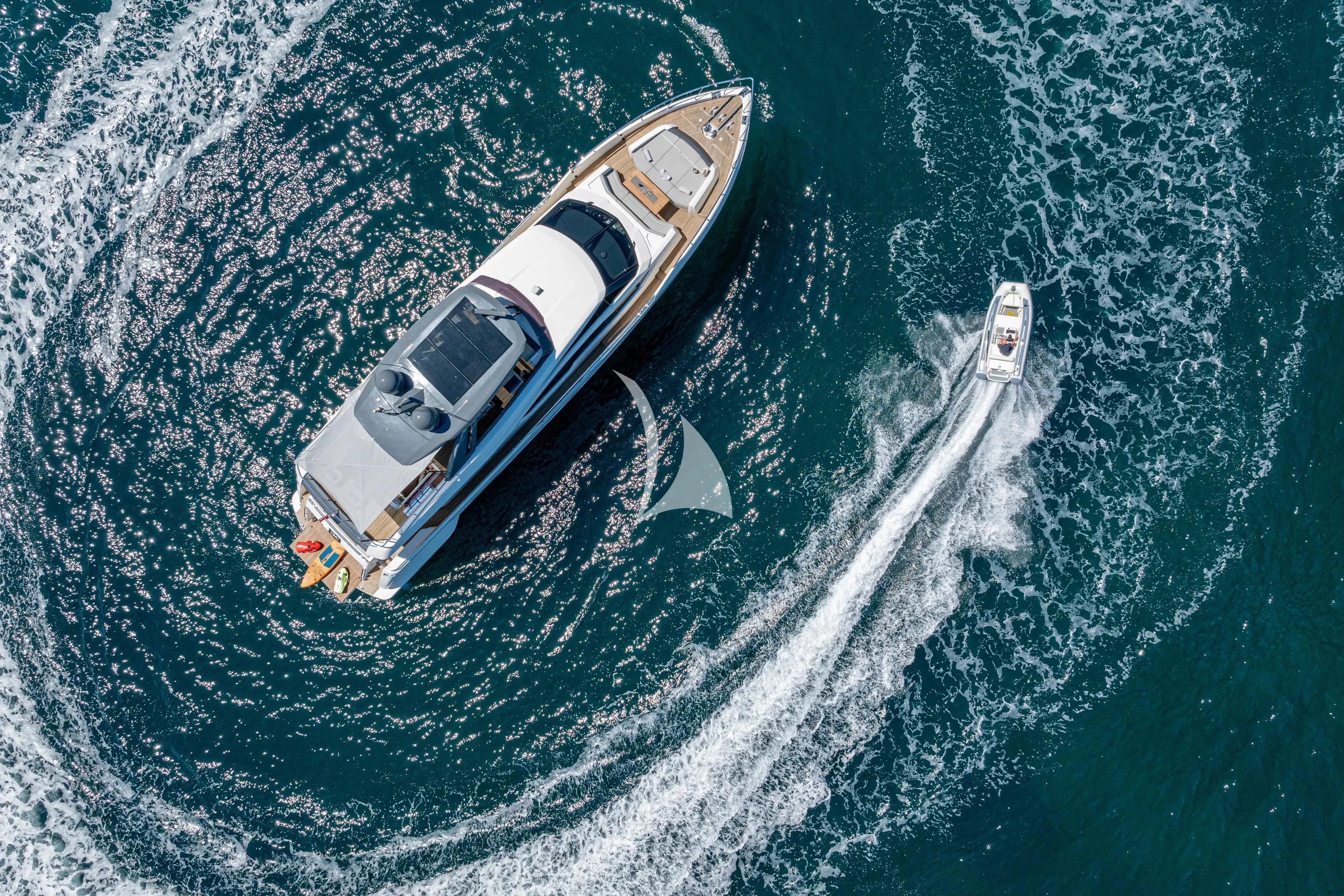 a helicopter flying over a body of water aboard E3 Yacht for Sale