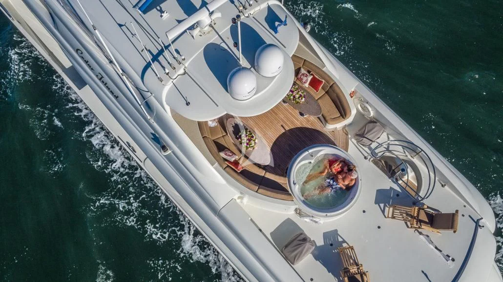 a boat with a person on it aboard CEDAR ISLAND Yacht for Sale