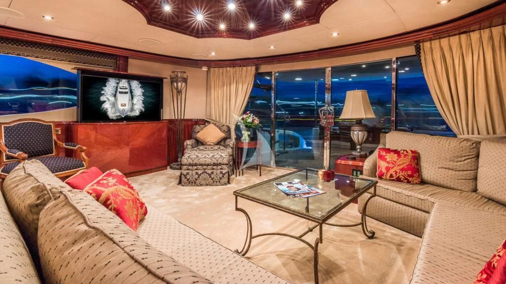a living room with a large screen aboard CEDAR ISLAND Yacht for Sale